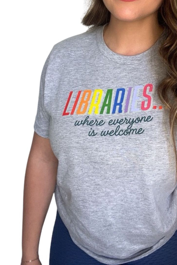 Shop Libraries Where Everyone is Welcome Classic Tee | Kind Cotton- at Ruby Joy Boutique, a Women's Clothing Store in Pickerington, Ohio