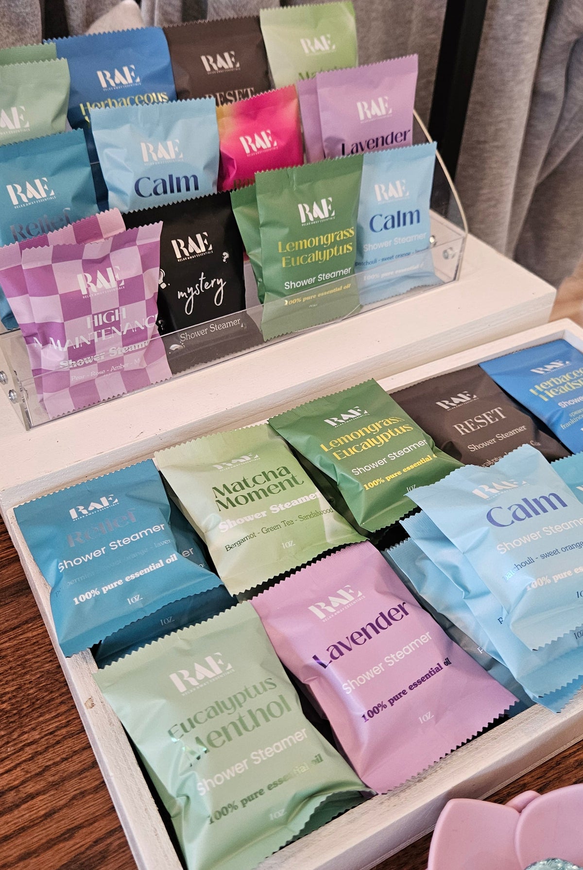 A display of RAE shower steamers on a table.