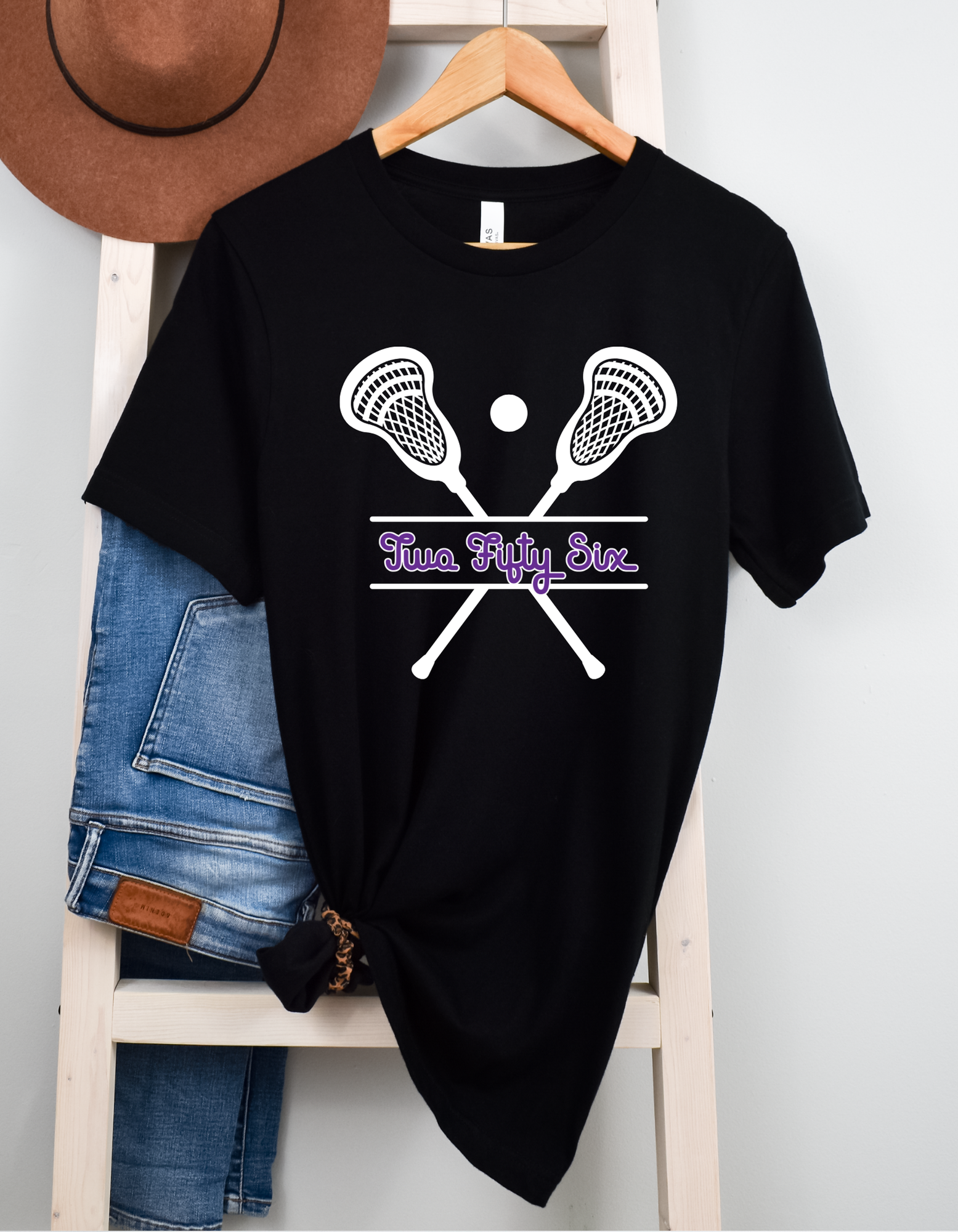 Shop 256 Lacrosse Sticks Graphic Tee-Small at Ruby Joy Boutique, a Women's Clothing Store in Pickerington, Ohio