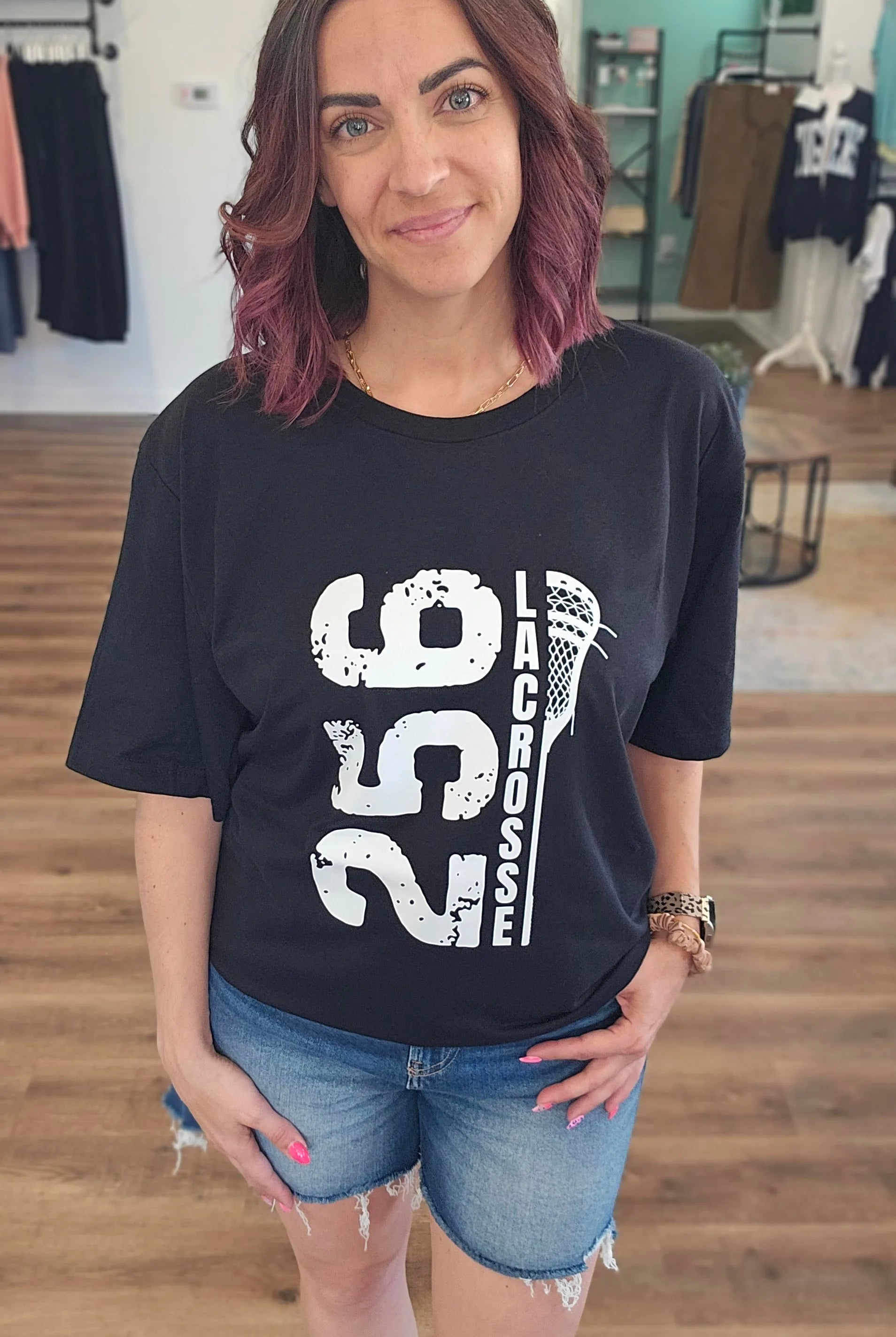 Shop 256 Vertical Lacrosse Stick Graphic Tee- at Ruby Joy Boutique, a Women's Clothing Store in Pickerington, Ohio