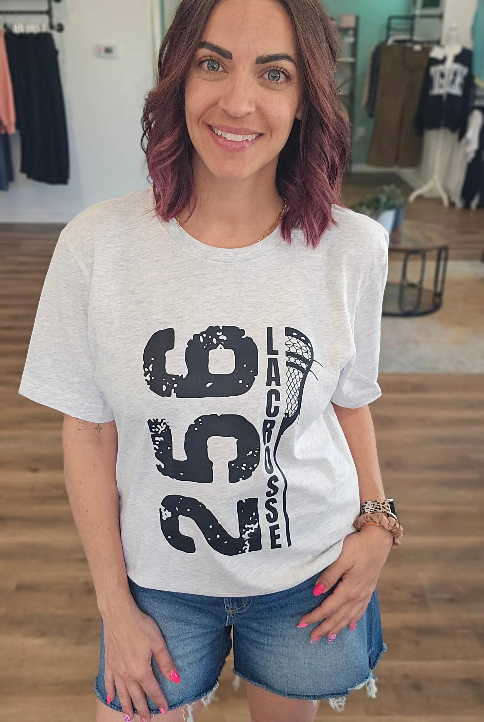 Shop 256 Vertical Lacrosse Stick Graphic Tee- at Ruby Joy Boutique, a Women's Clothing Store in Pickerington, Ohio