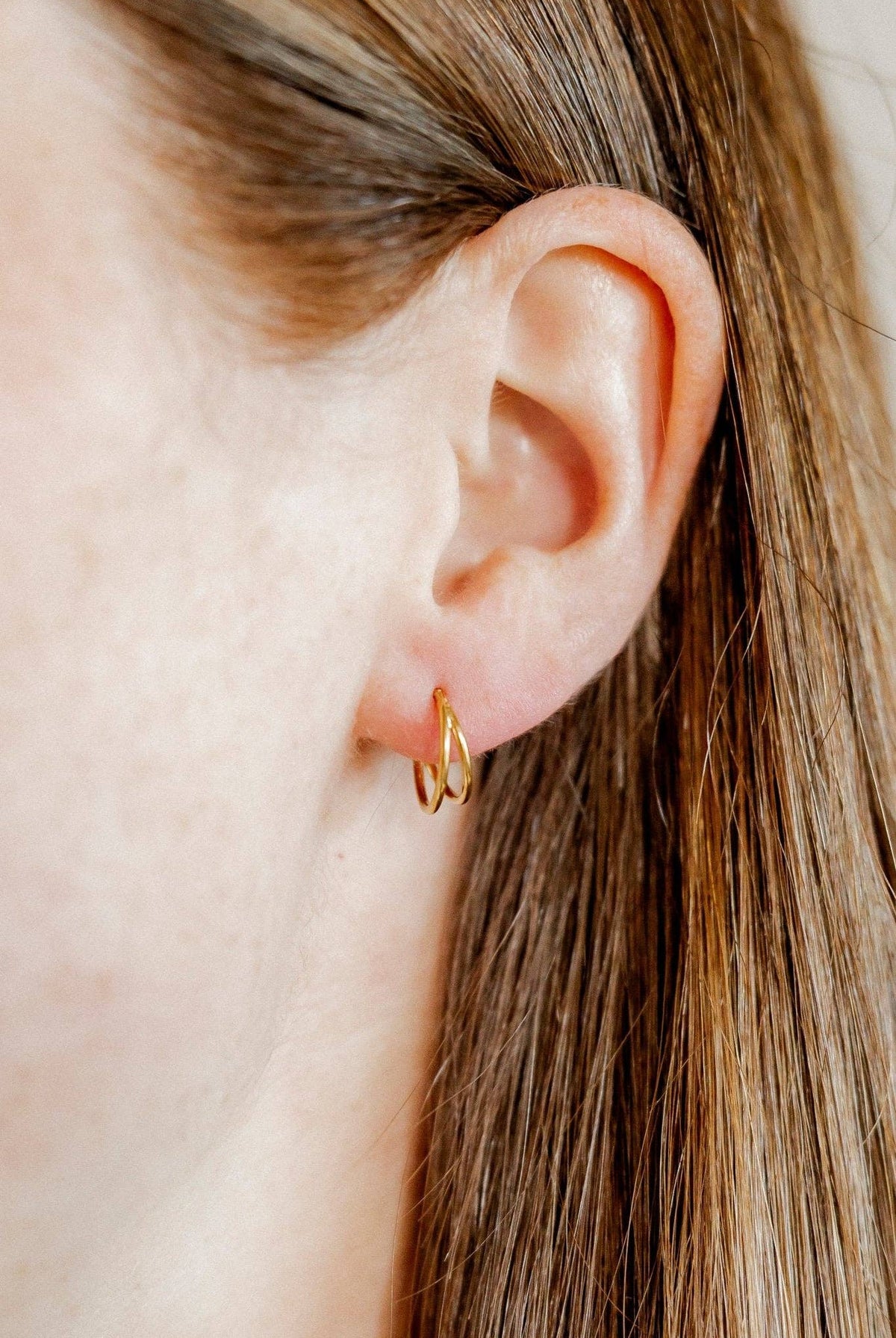 Shop Nylah Huggie Earrings - 10mm Gold- at Ruby Joy Boutique, a Women's Clothing Store in Pickerington, Ohio