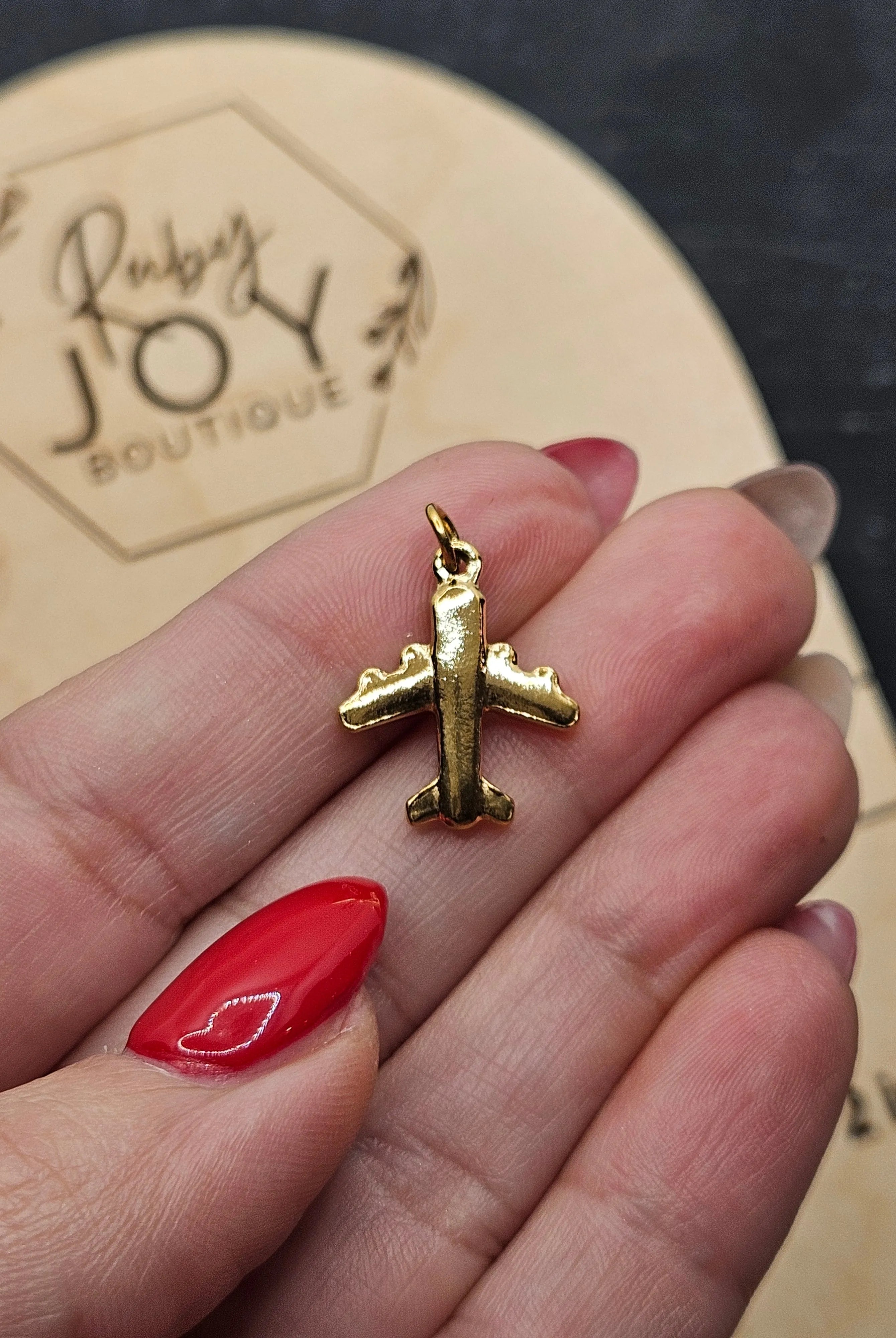 Shop Airplane Charm- at Ruby Joy Boutique, a Women's Clothing Store in Pickerington, Ohio