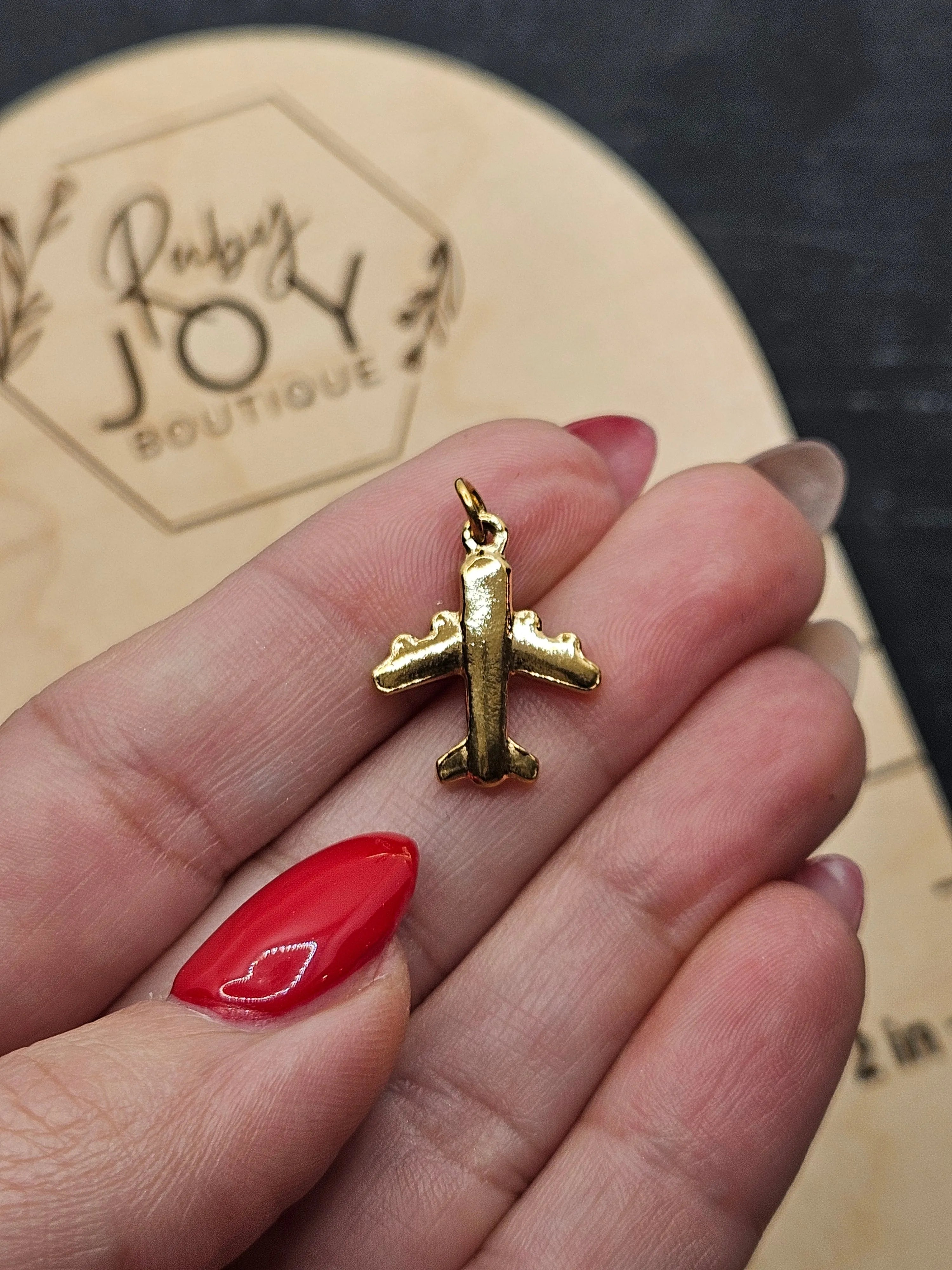 Shop Airplane Charm- at Ruby Joy Boutique, a Women's Clothing Store in Pickerington, Ohio