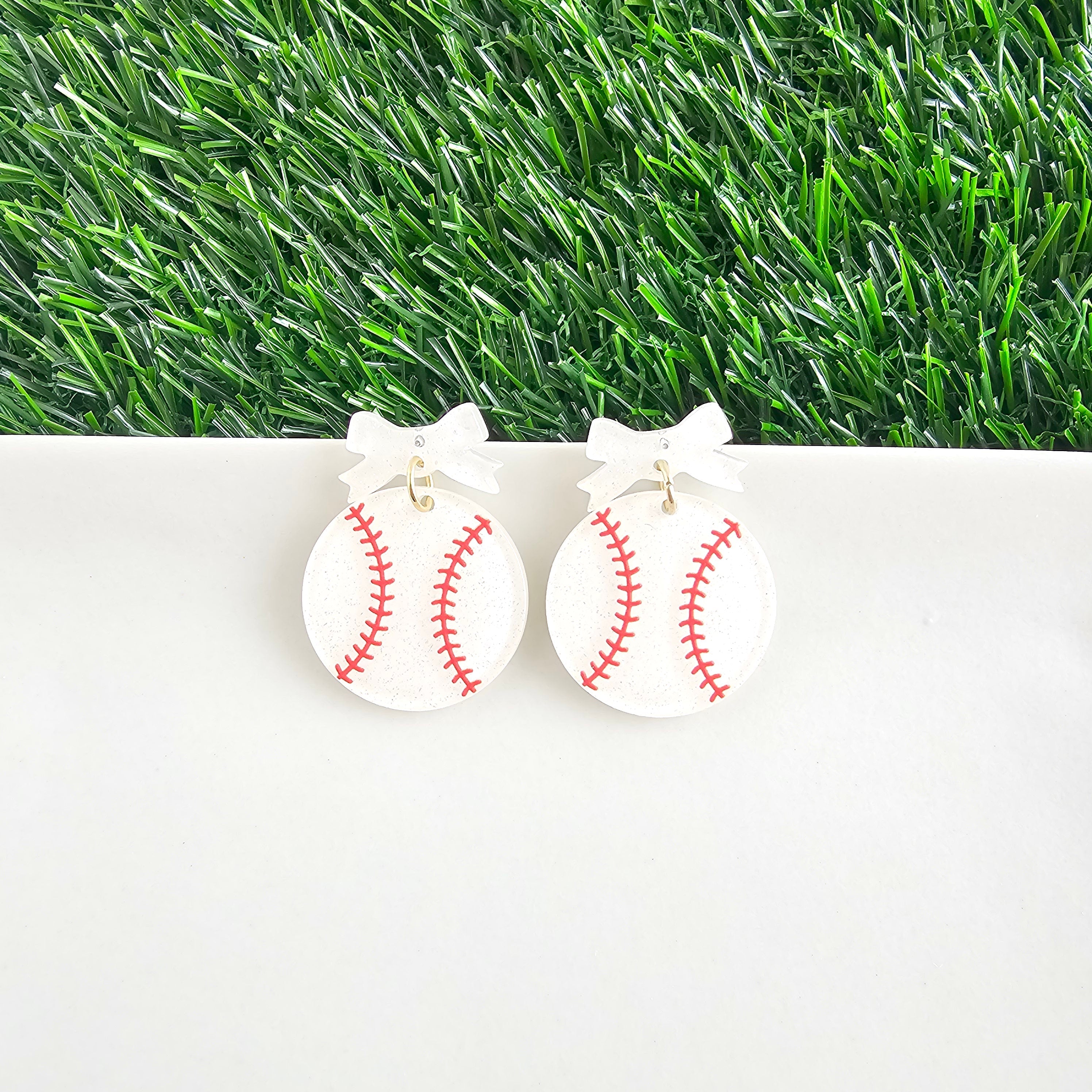 Shop Bow Baseball Earrings- at Ruby Joy Boutique, a Women's Clothing Store in Pickerington, Ohio