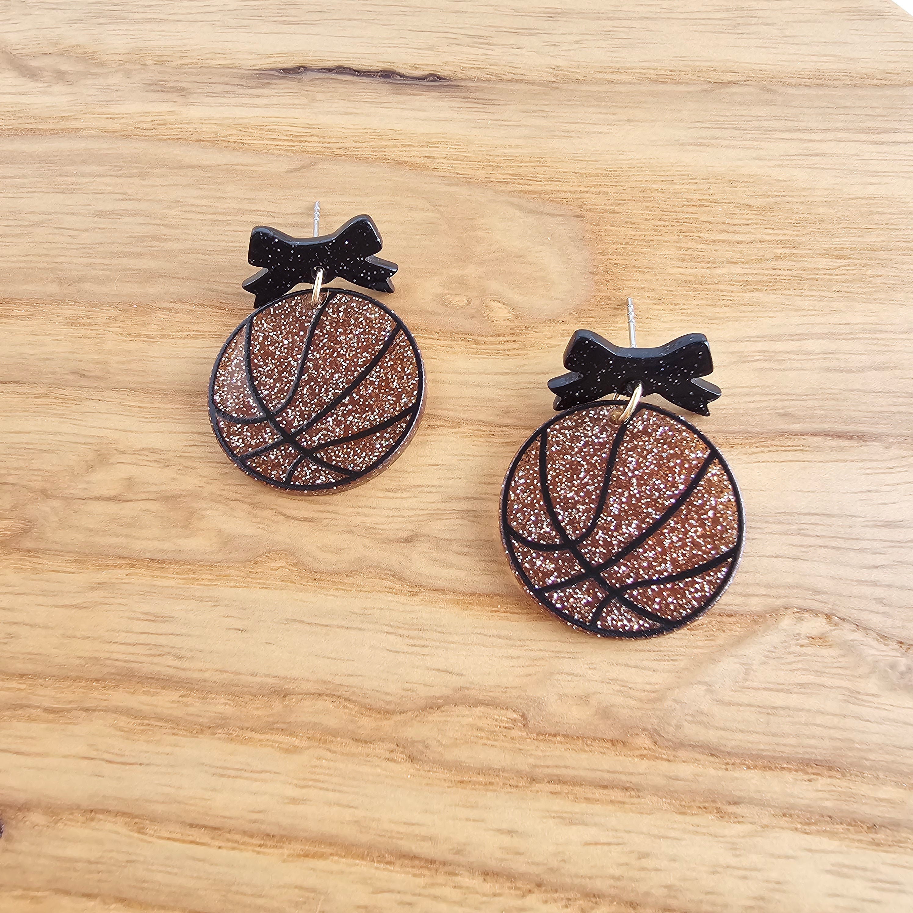 Shop Bow Basketball Earrings- at Ruby Joy Boutique, a Women's Clothing Store in Pickerington, Ohio