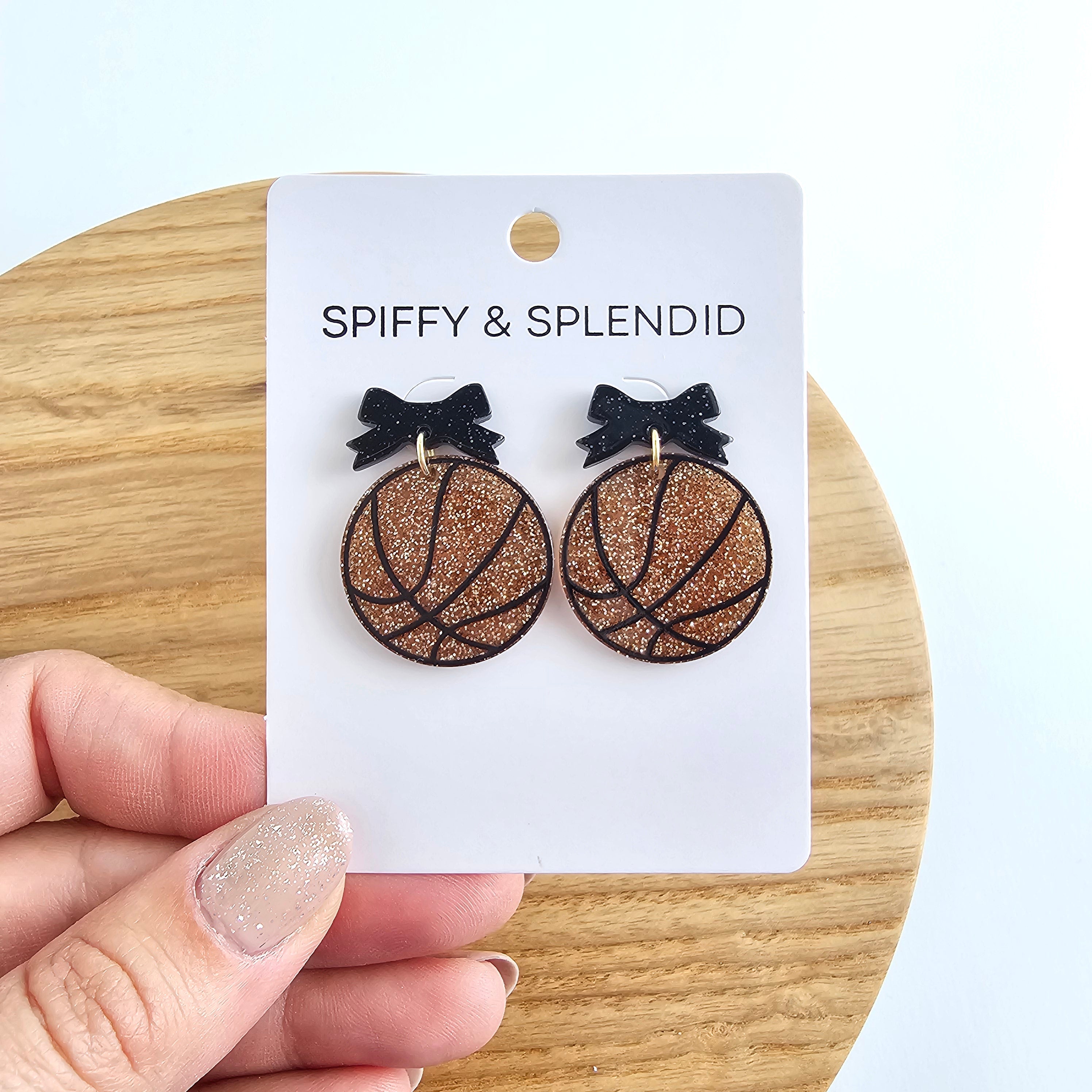Shop Bow Basketball Earrings- at Ruby Joy Boutique, a Women's Clothing Store in Pickerington, Ohio