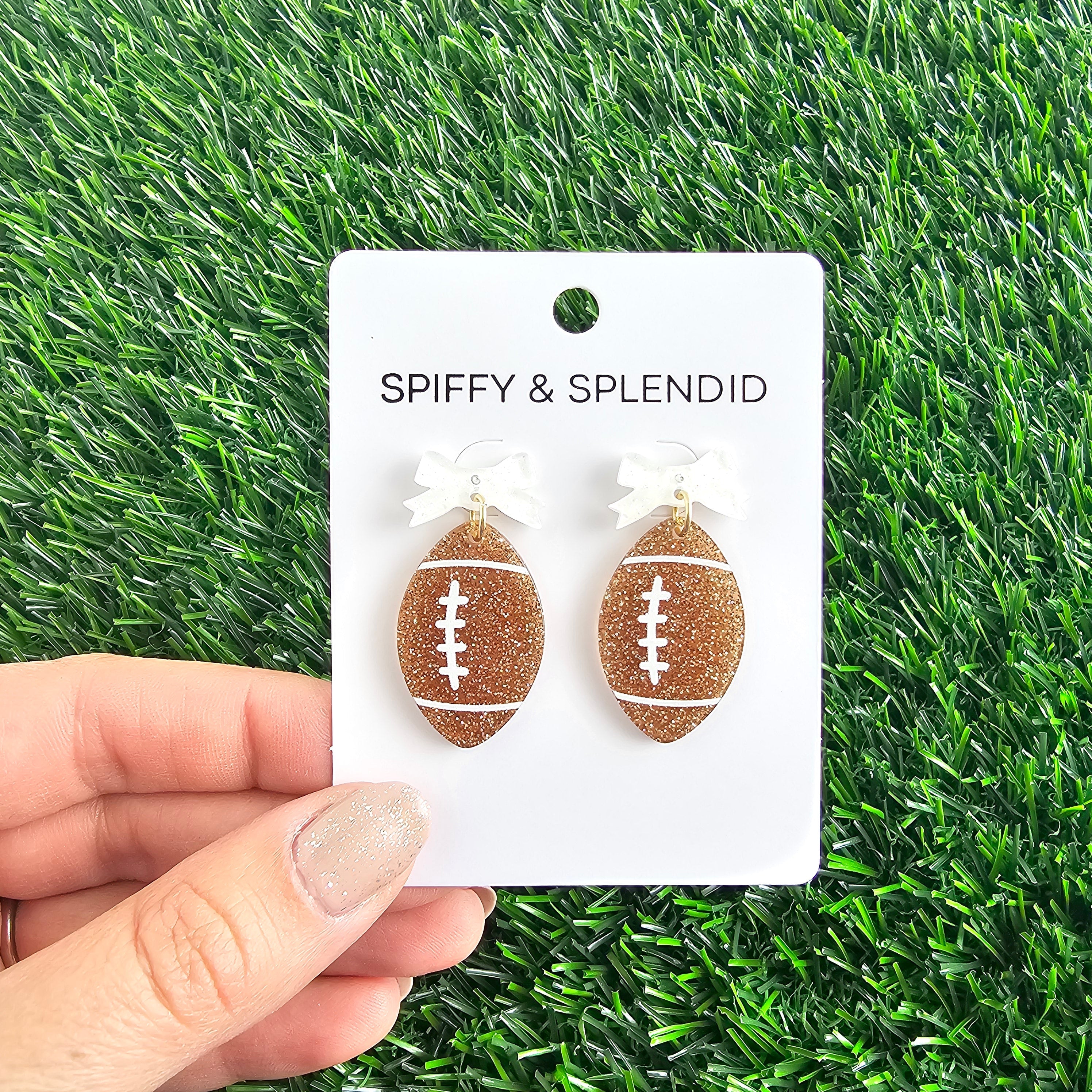 Shop Bow Football Earrings- at Ruby Joy Boutique, a Women's Clothing Store in Pickerington, Ohio