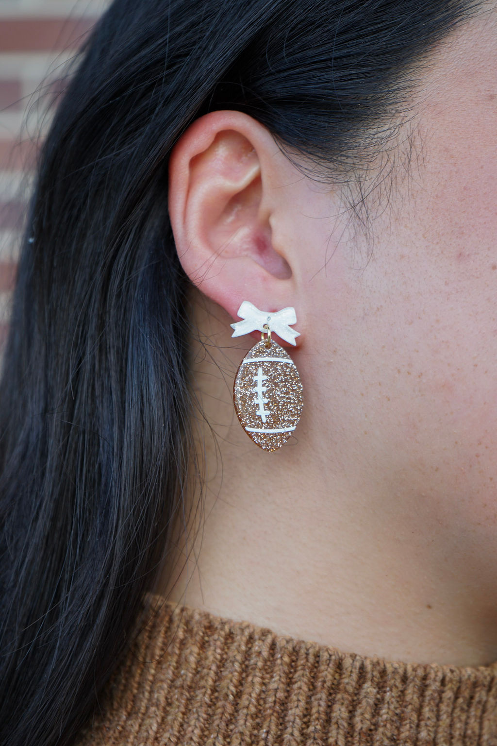 Shop Bow Football Earrings- at Ruby Joy Boutique, a Women's Clothing Store in Pickerington, Ohio