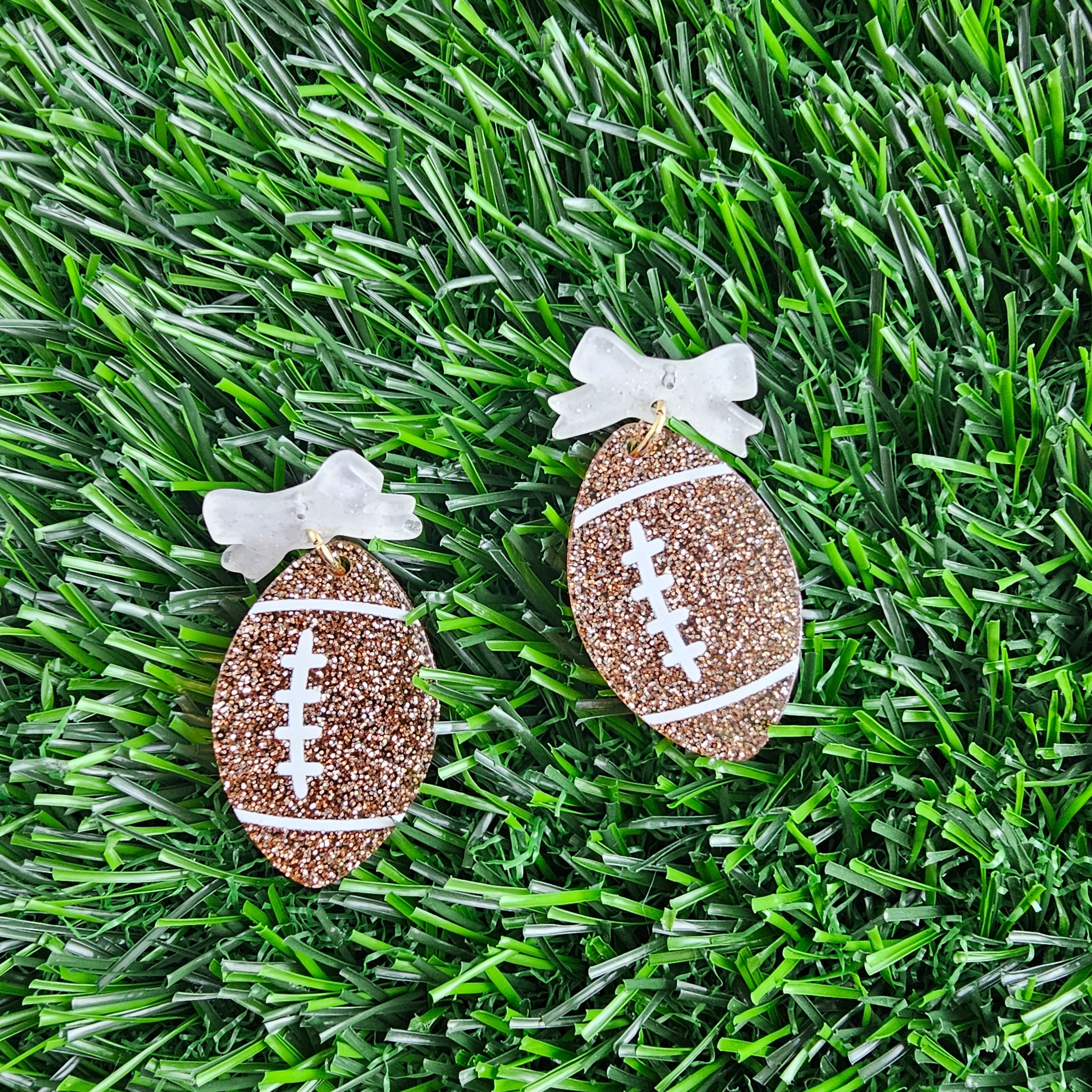 Shop Bow Football Earrings- at Ruby Joy Boutique, a Women's Clothing Store in Pickerington, Ohio