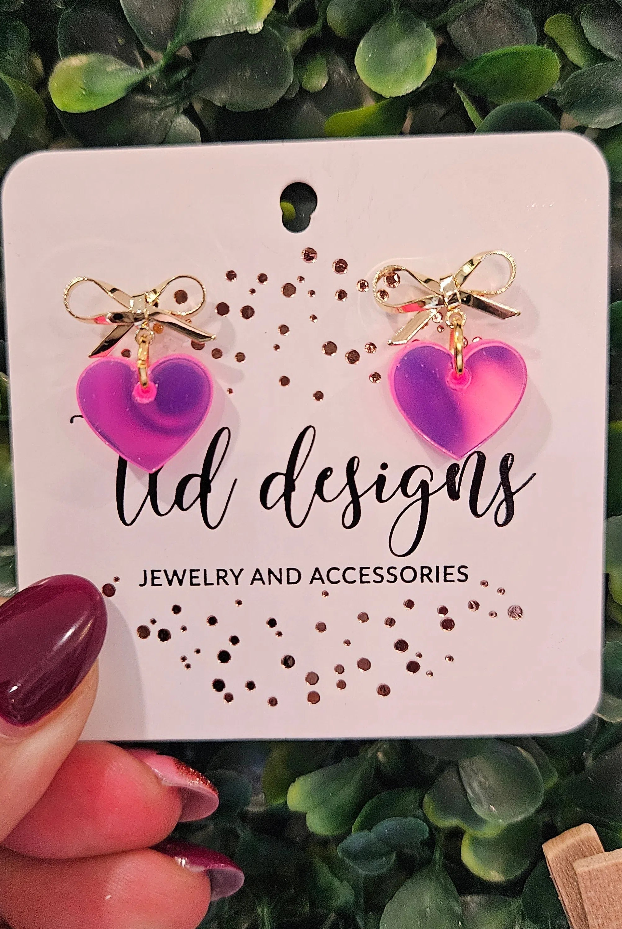 Shop Bow Heart Dangle Earrings-Pink Iridescent at Ruby Joy Boutique, a Women's Clothing Store in Pickerington, Ohio