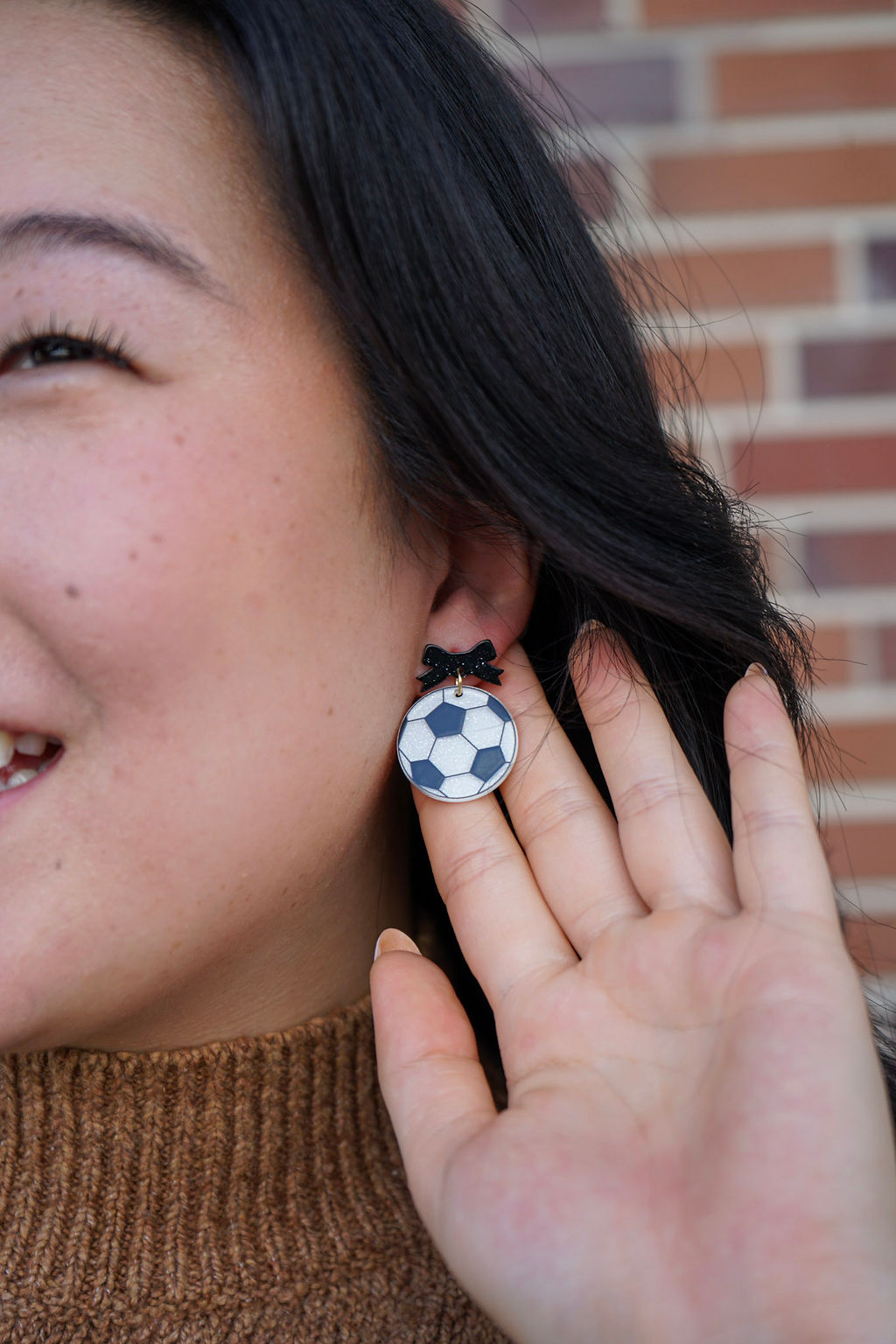 Shop Bow Soccer Ball Earrings- at Ruby Joy Boutique, a Women's Clothing Store in Pickerington, Ohio