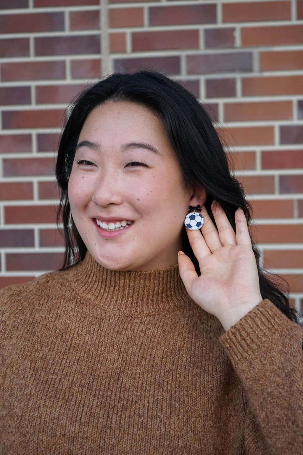 Shop Bow Soccer Ball Earrings- at Ruby Joy Boutique, a Women's Clothing Store in Pickerington, Ohio