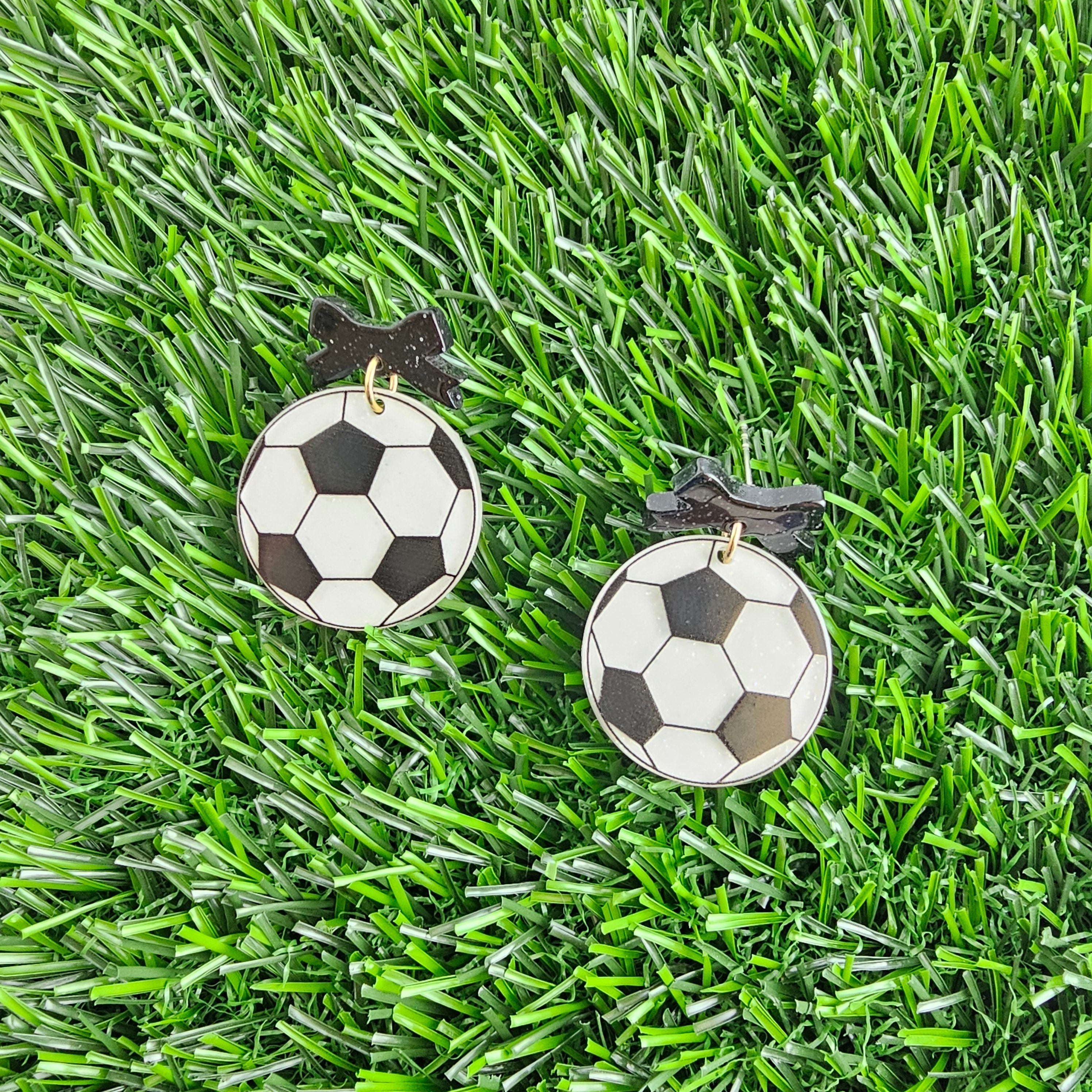 Shop Bow Soccer Ball Earrings- at Ruby Joy Boutique, a Women's Clothing Store in Pickerington, Ohio