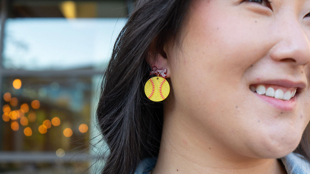 Shop Bow Softball Earrings- at Ruby Joy Boutique, a Women's Clothing Store in Pickerington, Ohio