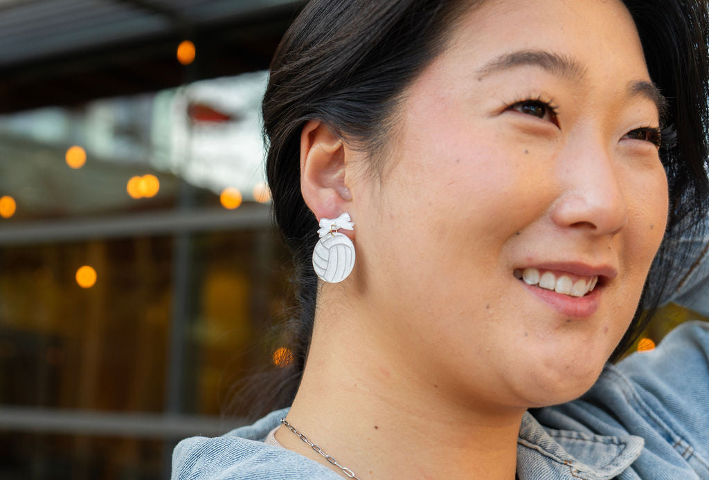 Shop Bow Volleyball Earrings- at Ruby Joy Boutique, a Women's Clothing Store in Pickerington, Ohio