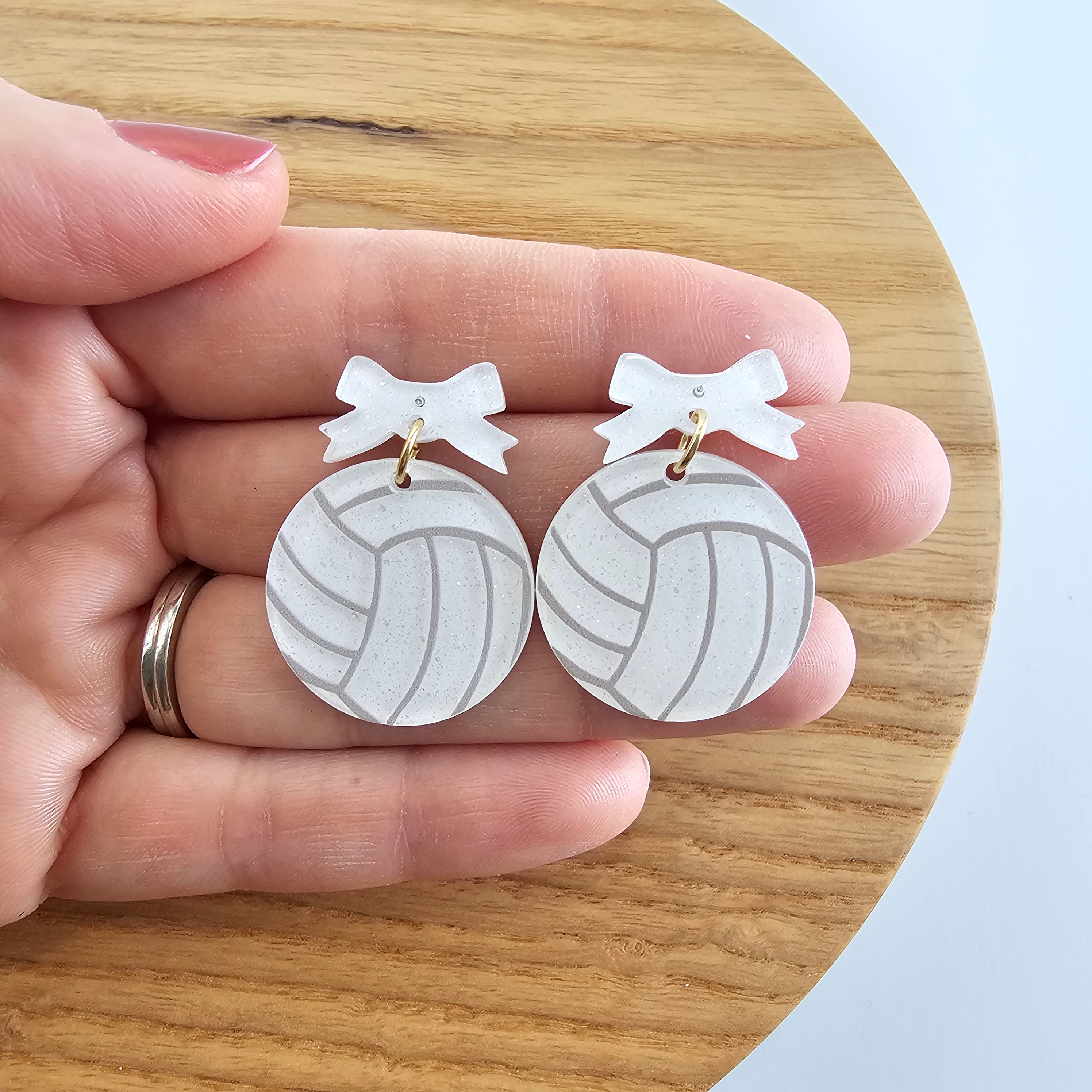 Shop Bow Volleyball Earrings- at Ruby Joy Boutique, a Women's Clothing Store in Pickerington, Ohio