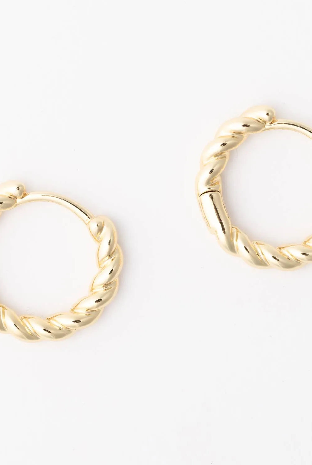 Shop Brandi Twisted Huggie Earrings- at Ruby Joy Boutique, a Women's Clothing Store in Pickerington, Ohio