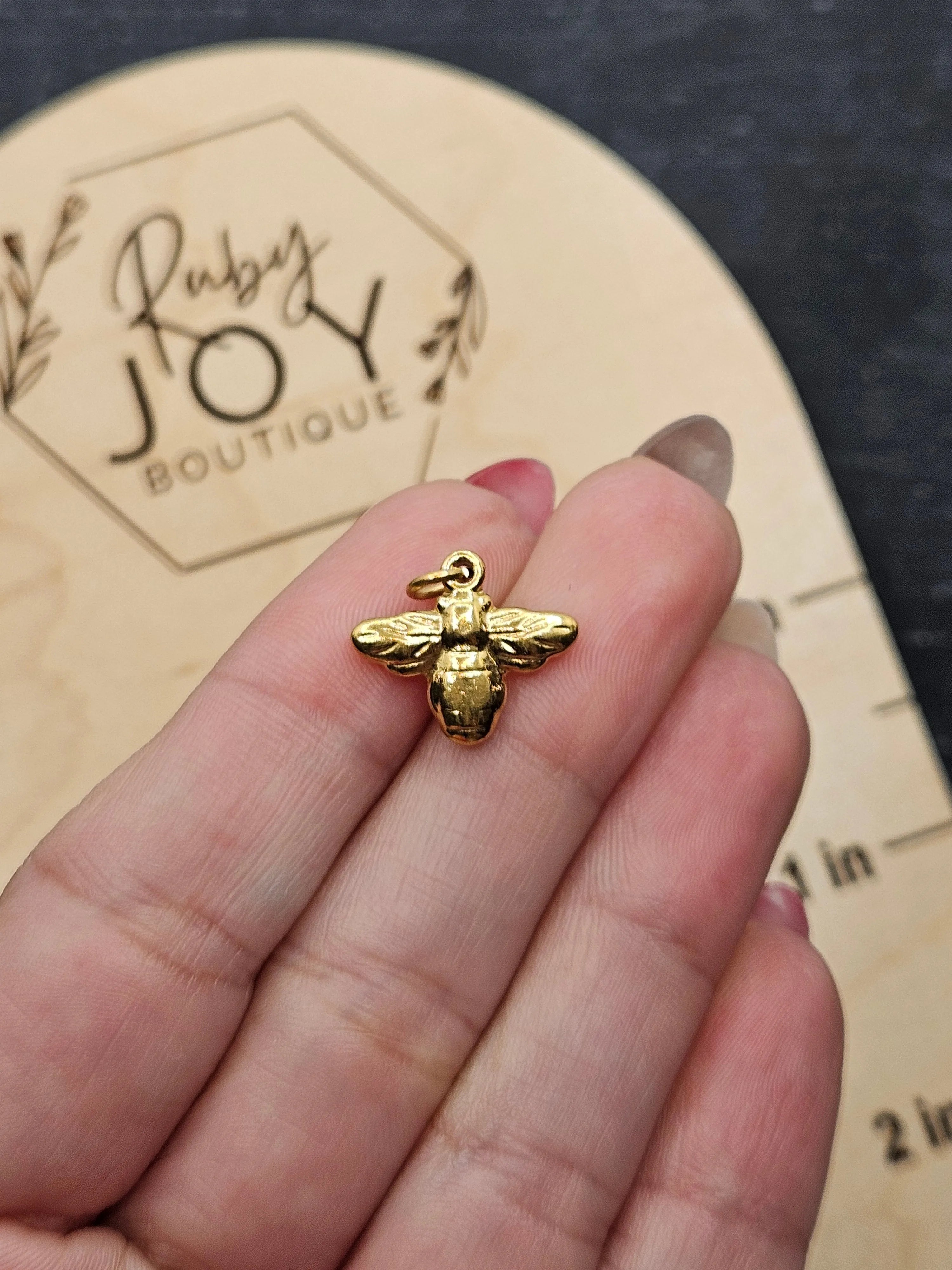 Shop Bumblebee Charm- at Ruby Joy Boutique, a Women's Clothing Store in Pickerington, Ohio