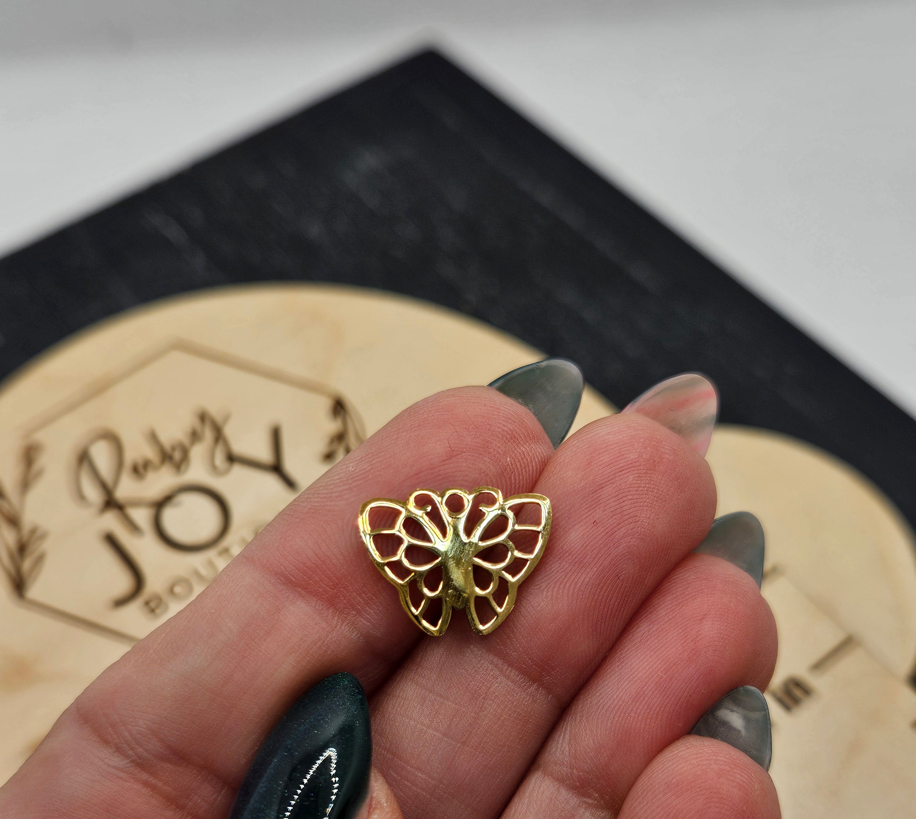 Shop Butterfly Charm- at Ruby Joy Boutique, a Women's Clothing Store in Pickerington, Ohio