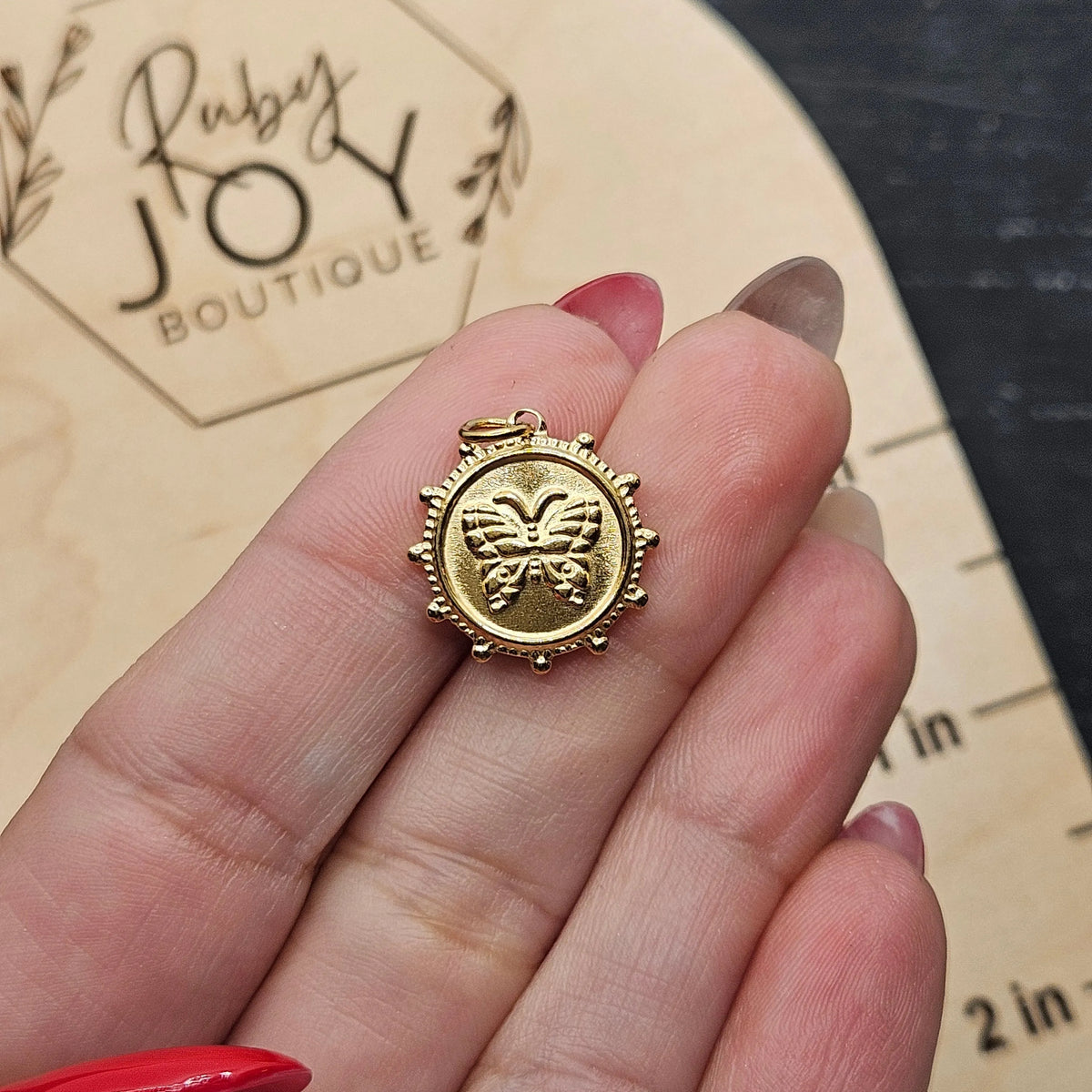 Shop Butterfly Coin Charm- at Ruby Joy Boutique, a Women's Clothing Store in Pickerington, Ohio