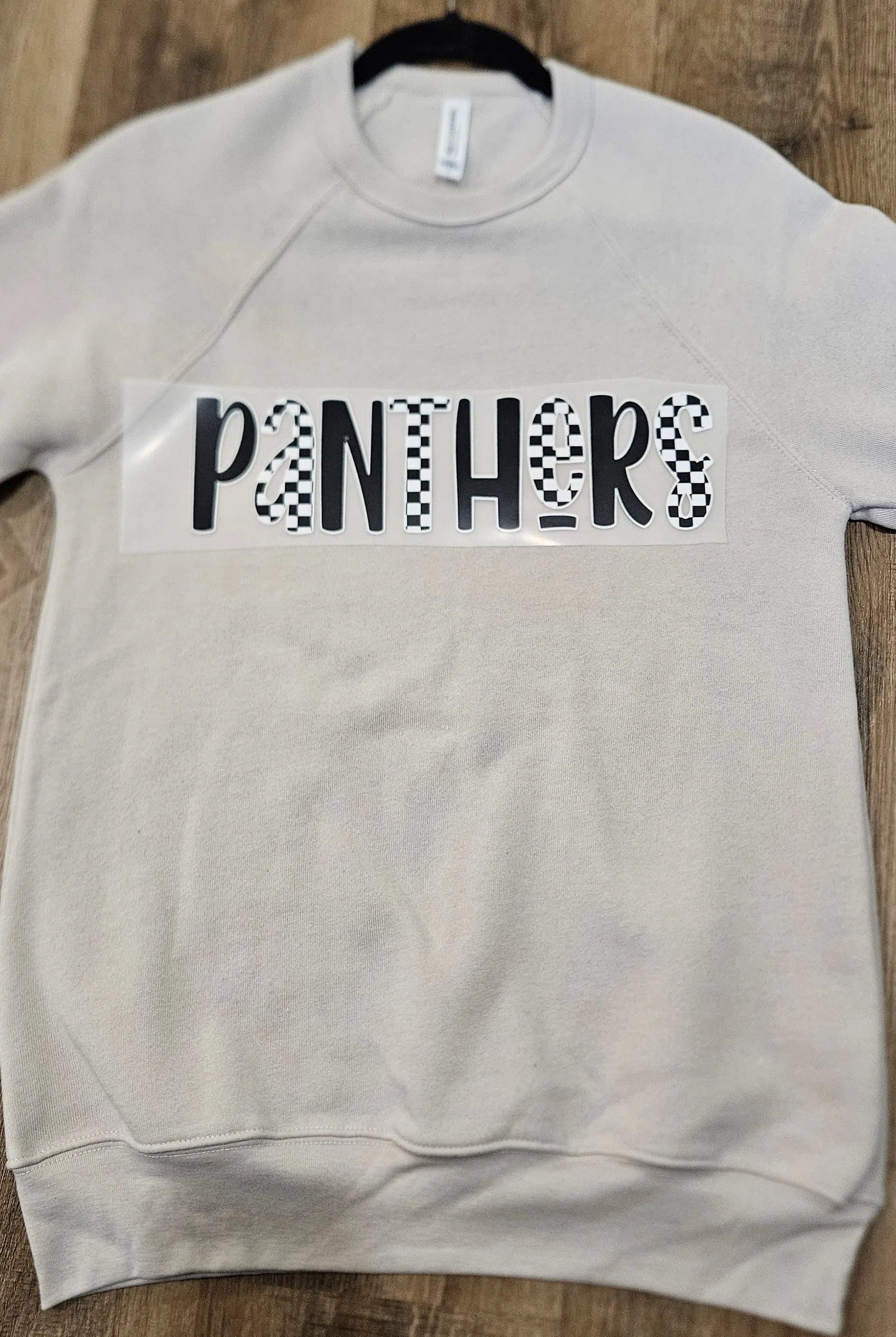 Shop Checkered Mascot Graphic - Panthers- at Ruby Joy Boutique, a Women's Clothing Store in Pickerington, Ohio