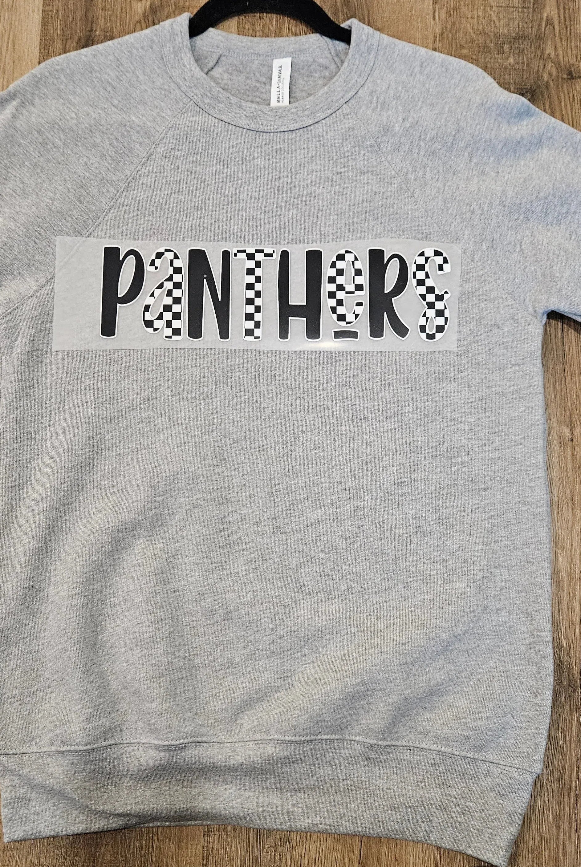 Shop Checkered Mascot Graphic - Panthers- at Ruby Joy Boutique, a Women's Clothing Store in Pickerington, Ohio