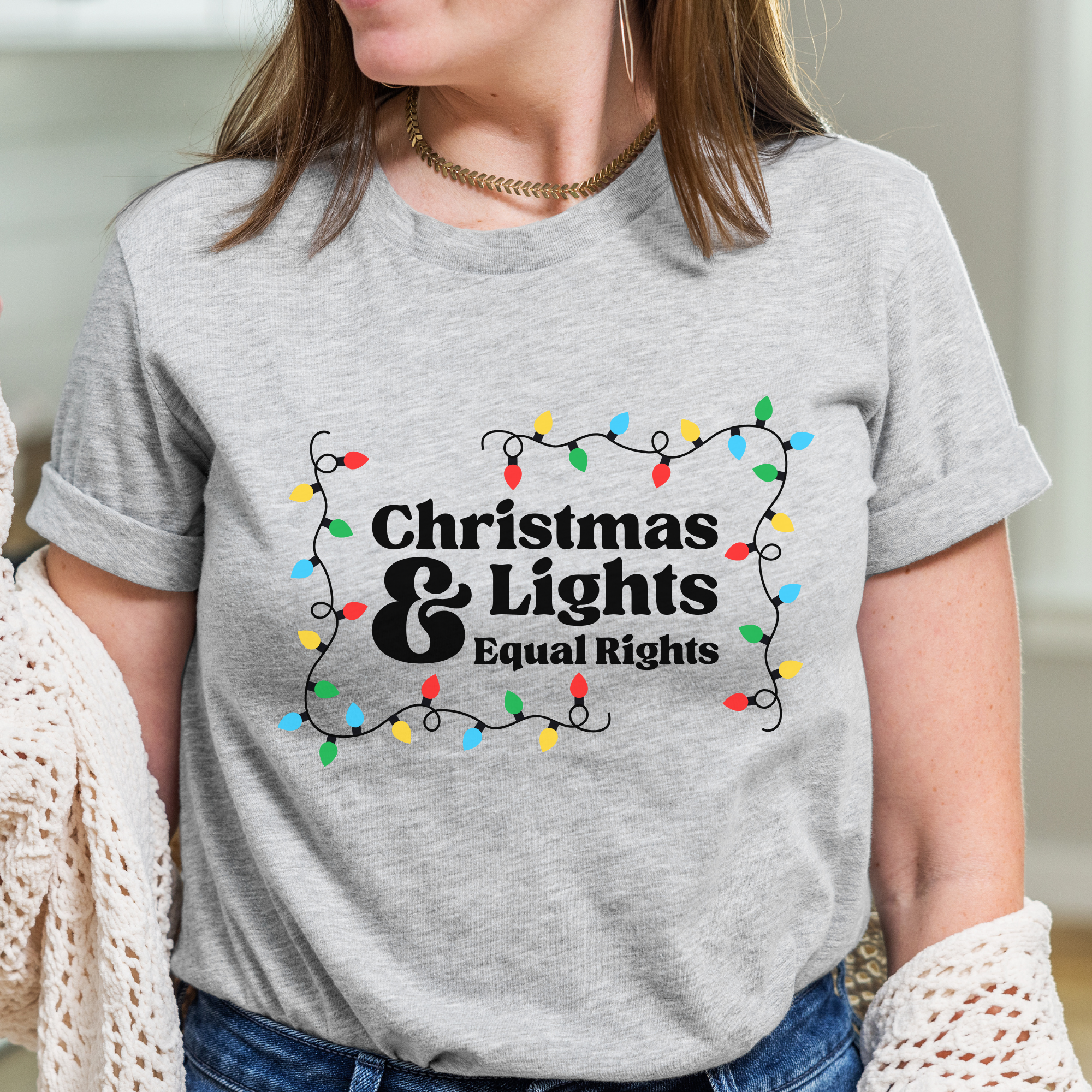 Shop Christmas Lights and Equal Rights Graphic Top- at Ruby Joy Boutique, a Women's Clothing Store in Pickerington, Ohio