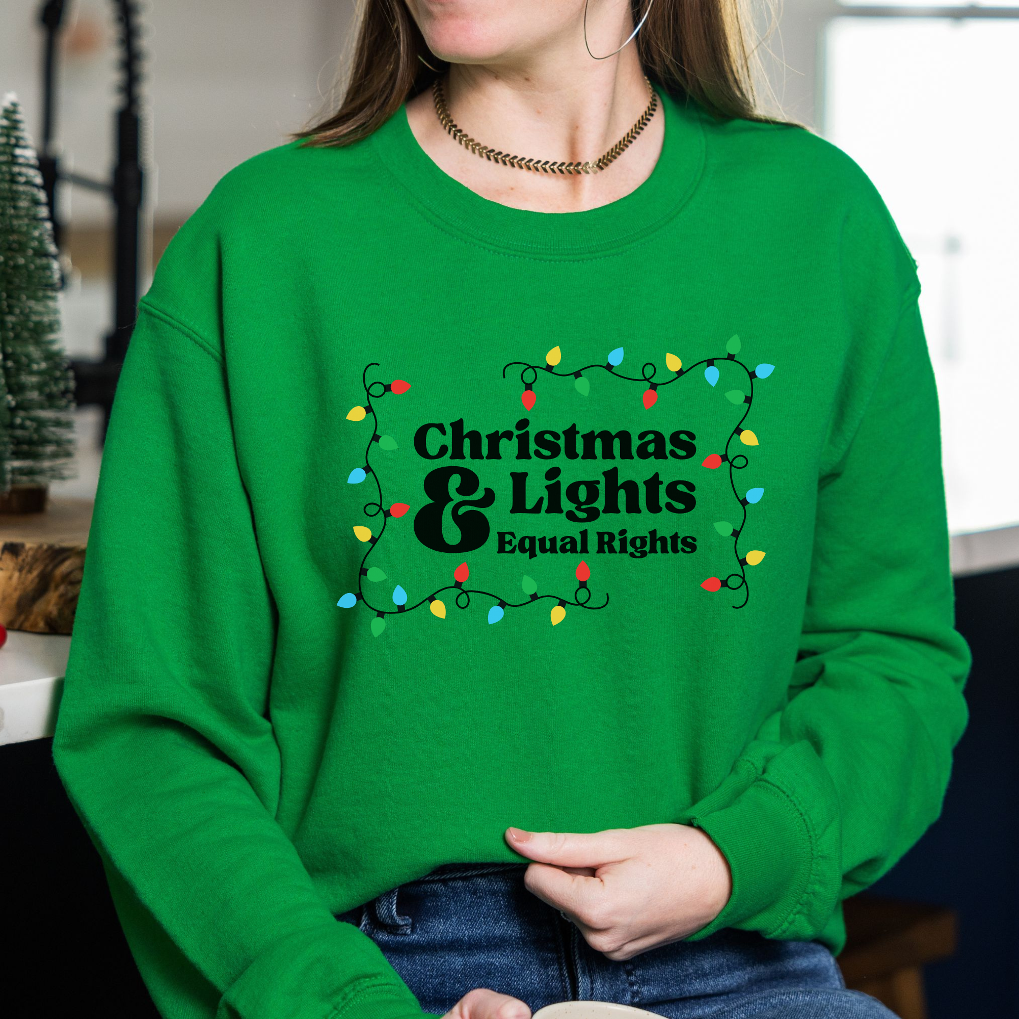 Shop Christmas Lights and Equal Rights Graphic Top- at Ruby Joy Boutique, a Women's Clothing Store in Pickerington, Ohio