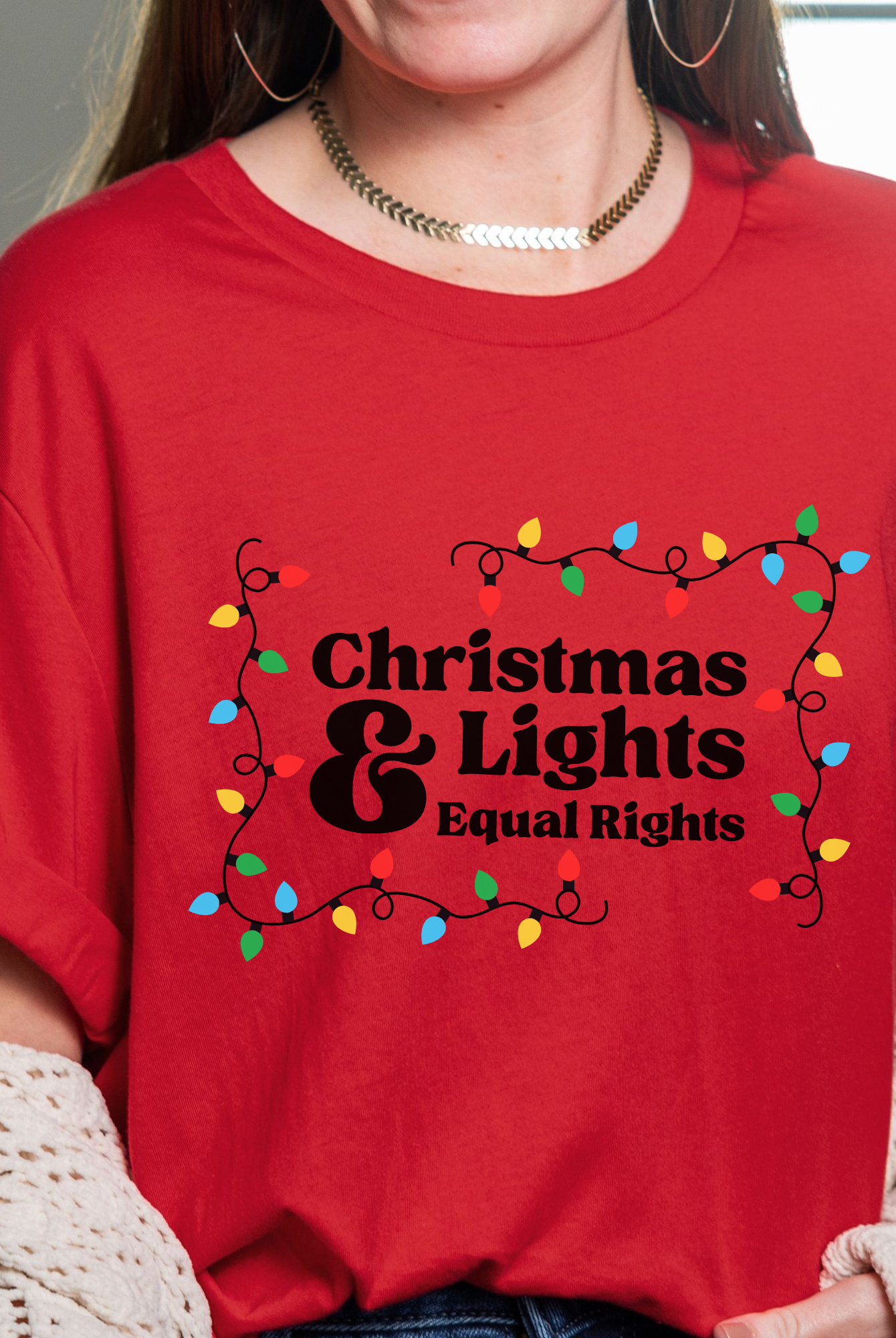 Shop Christmas Lights and Equal Rights Graphic Top- at Ruby Joy Boutique, a Women's Clothing Store in Pickerington, Ohio