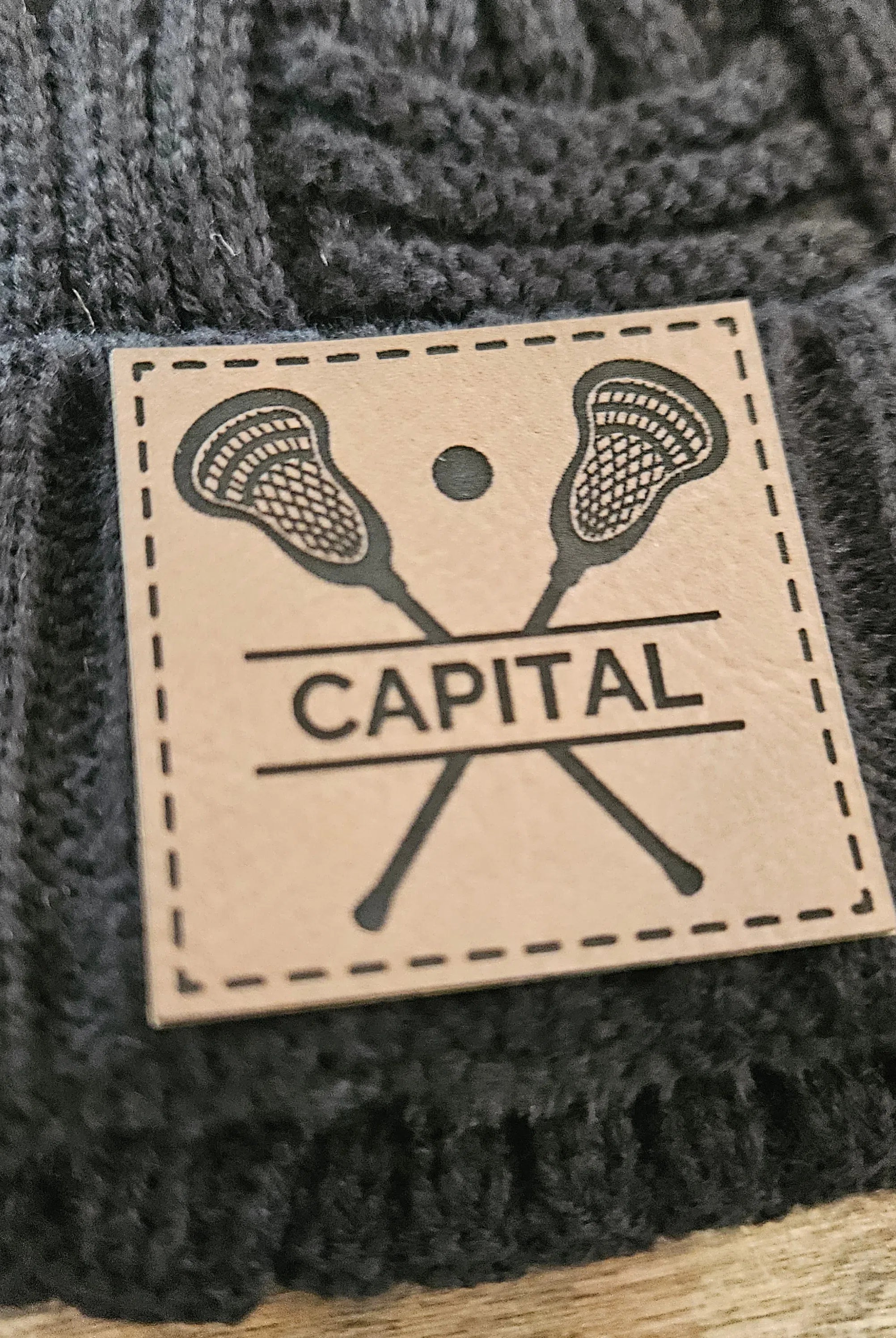 Shop Custom Lacrosse Patch Beanie- at Ruby Joy Boutique, a Women's Clothing Store in Pickerington, Ohio