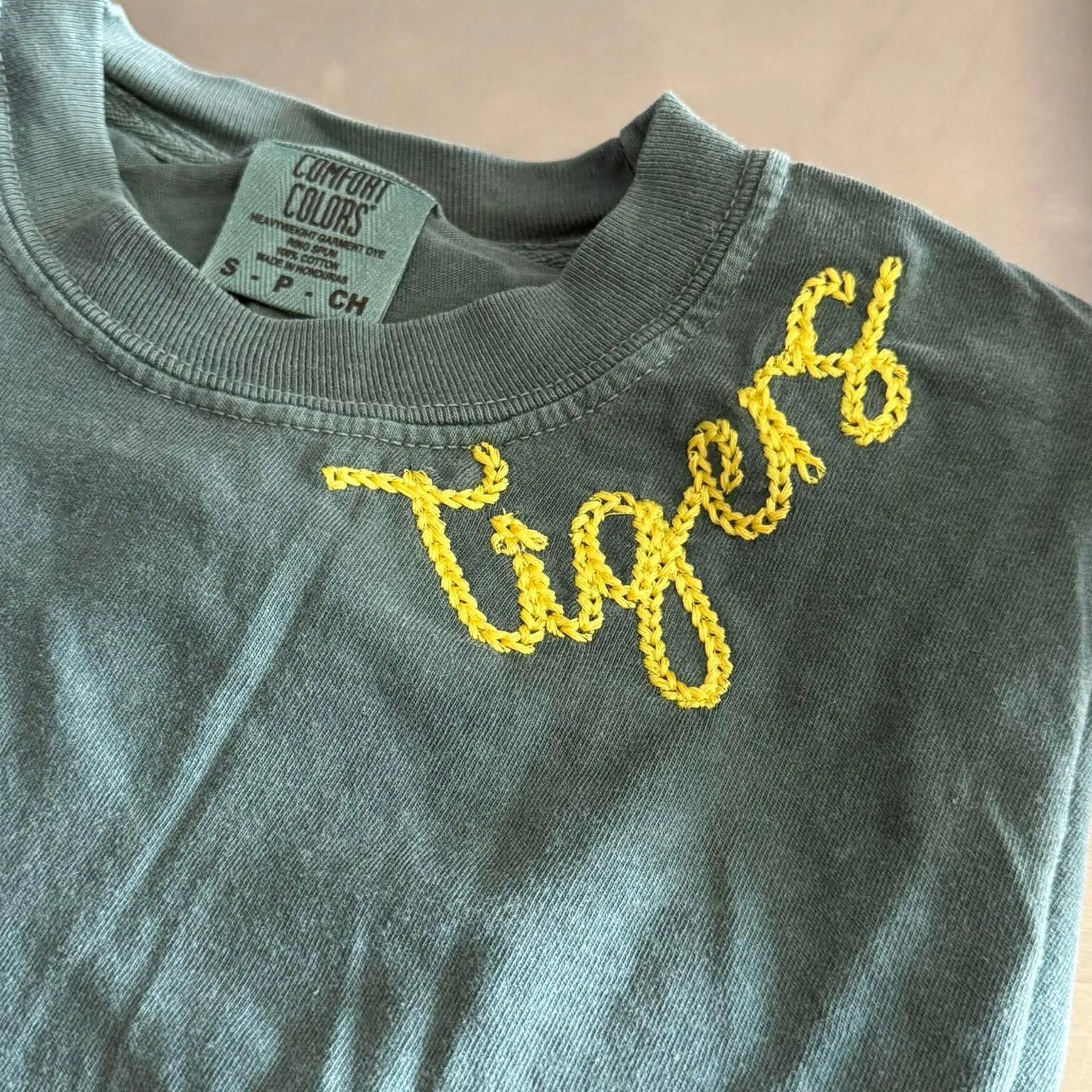 Shop Custom Retro Chainstitch Embroidered Top-T-Shirt at Ruby Joy Boutique, a Women's Clothing Store in Pickerington, Ohio