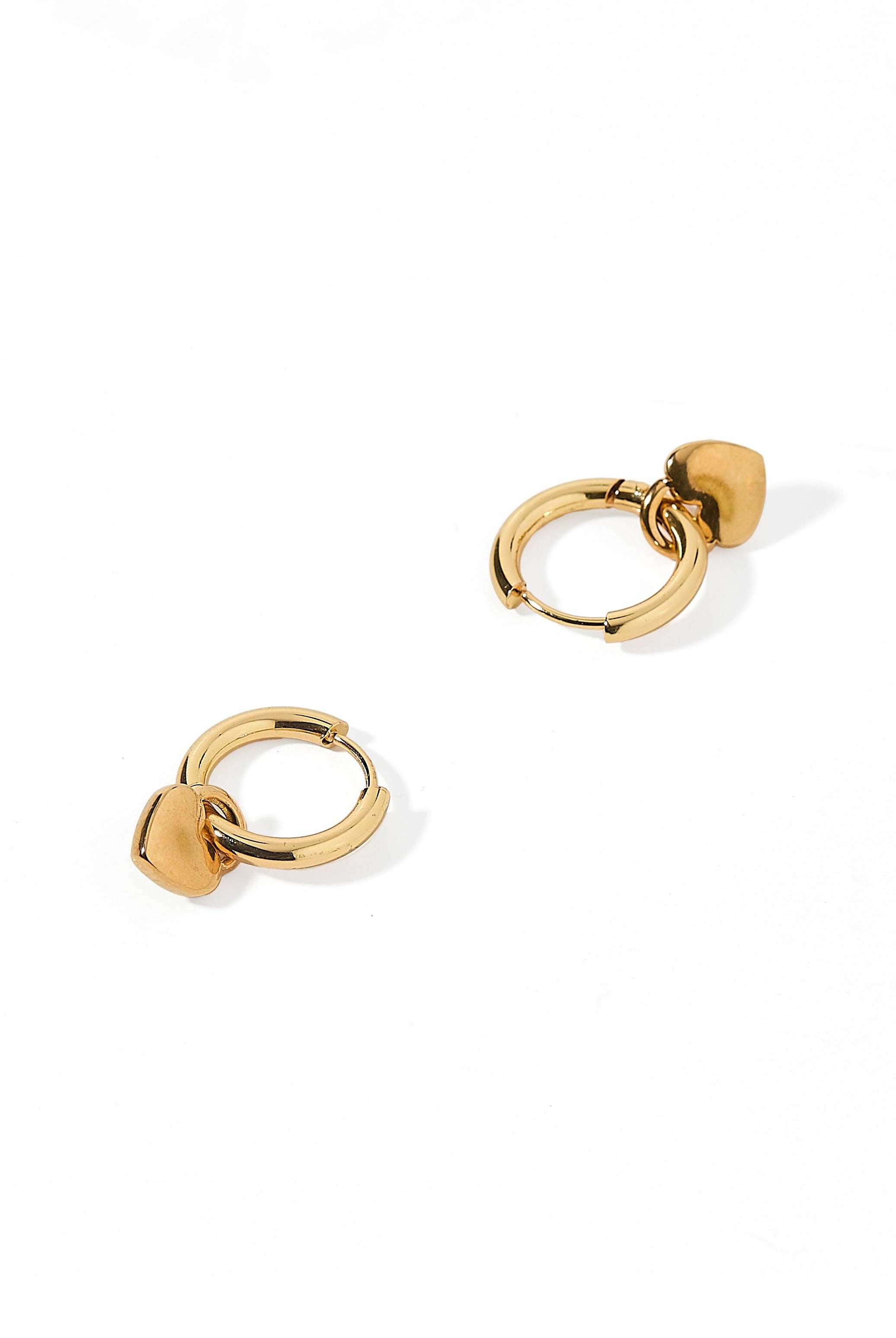 Shop Dakota Heart Huggie Charm Earrings- at Ruby Joy Boutique, a Women's Clothing Store in Pickerington, Ohio