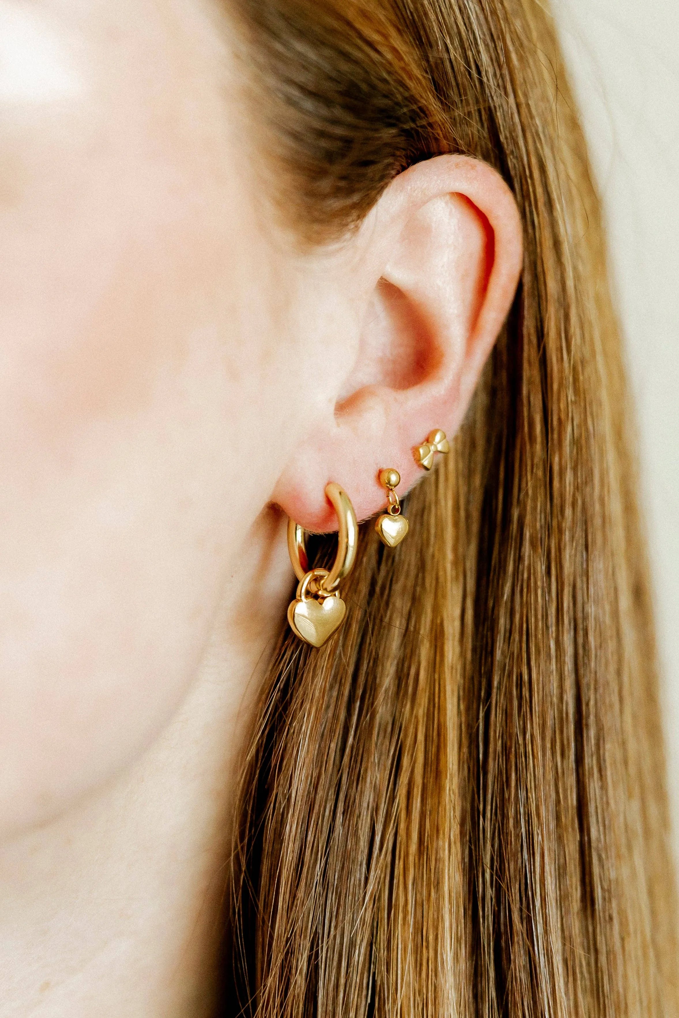 Shop Dakota Heart Huggie Charm Earrings- at Ruby Joy Boutique, a Women's Clothing Store in Pickerington, Ohio