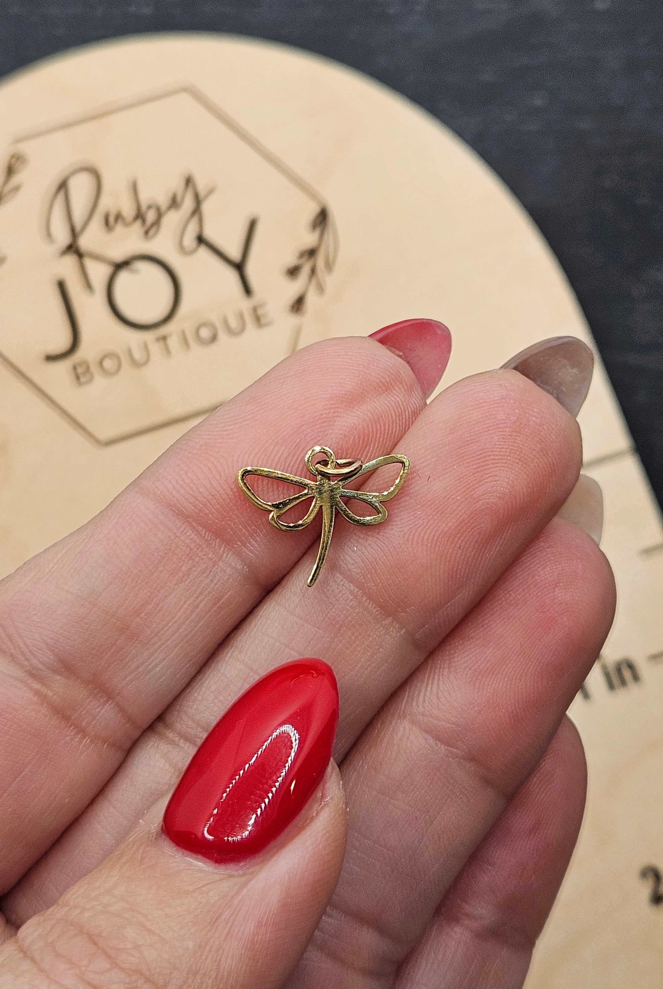 Shop Dragonfly Outline Charm- at Ruby Joy Boutique, a Women's Clothing Store in Pickerington, Ohio