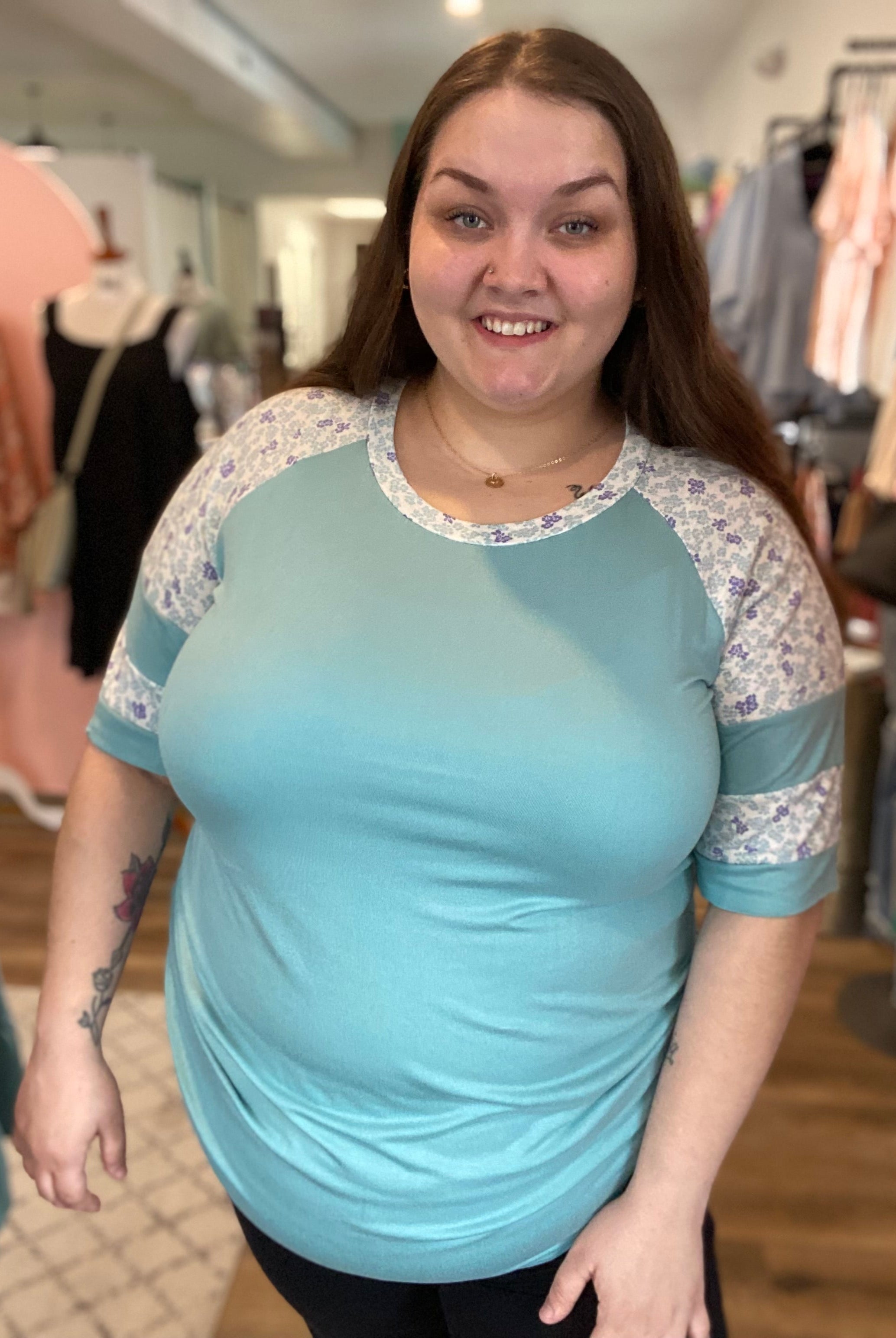 Shop Floral Baseball Sleeve Top-Short Sleeve Top at Ruby Joy Boutique, a Women's Clothing Store in Pickerington, Ohio