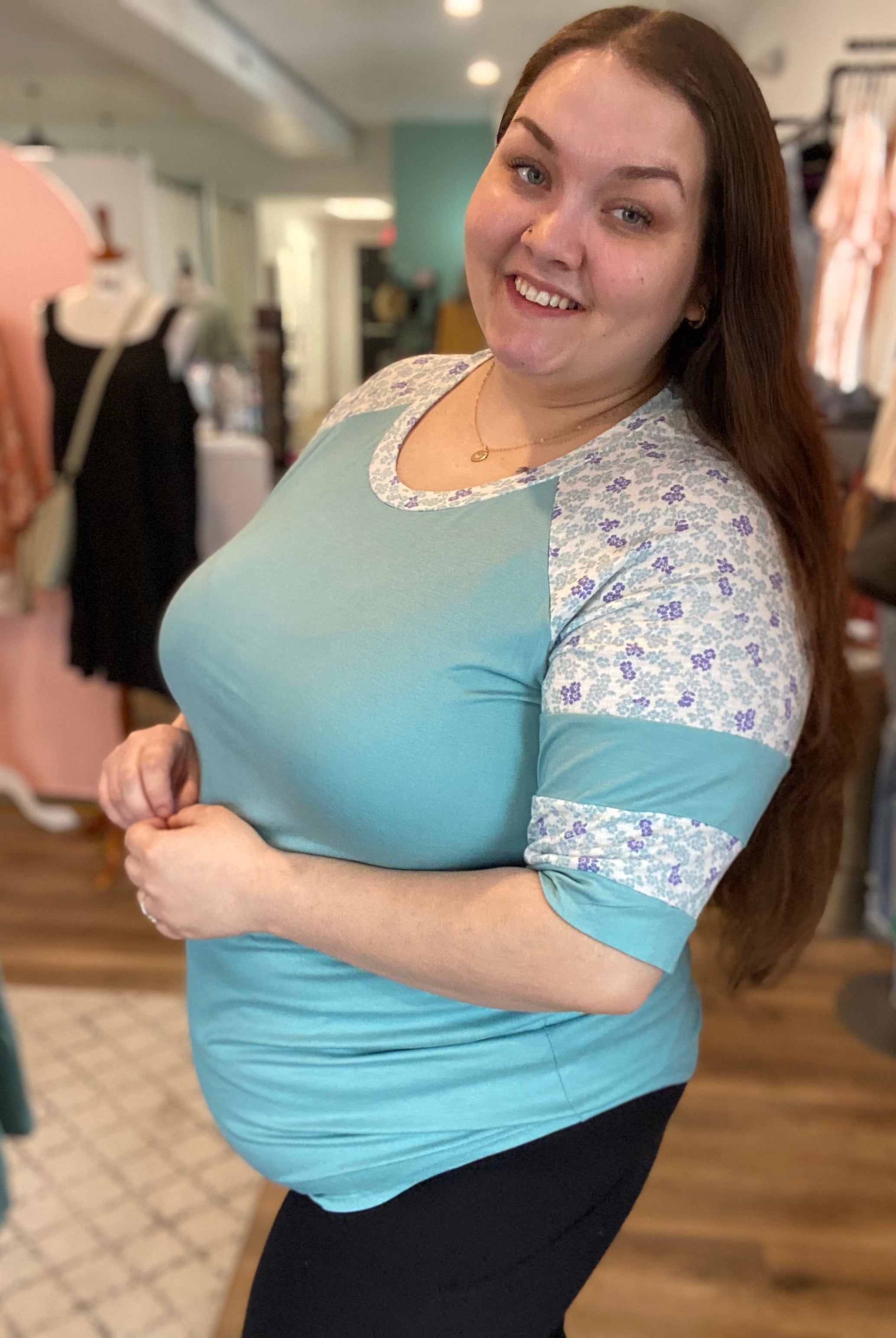 Shop Floral Baseball Sleeve Top-Short Sleeve Top at Ruby Joy Boutique, a Women's Clothing Store in Pickerington, Ohio