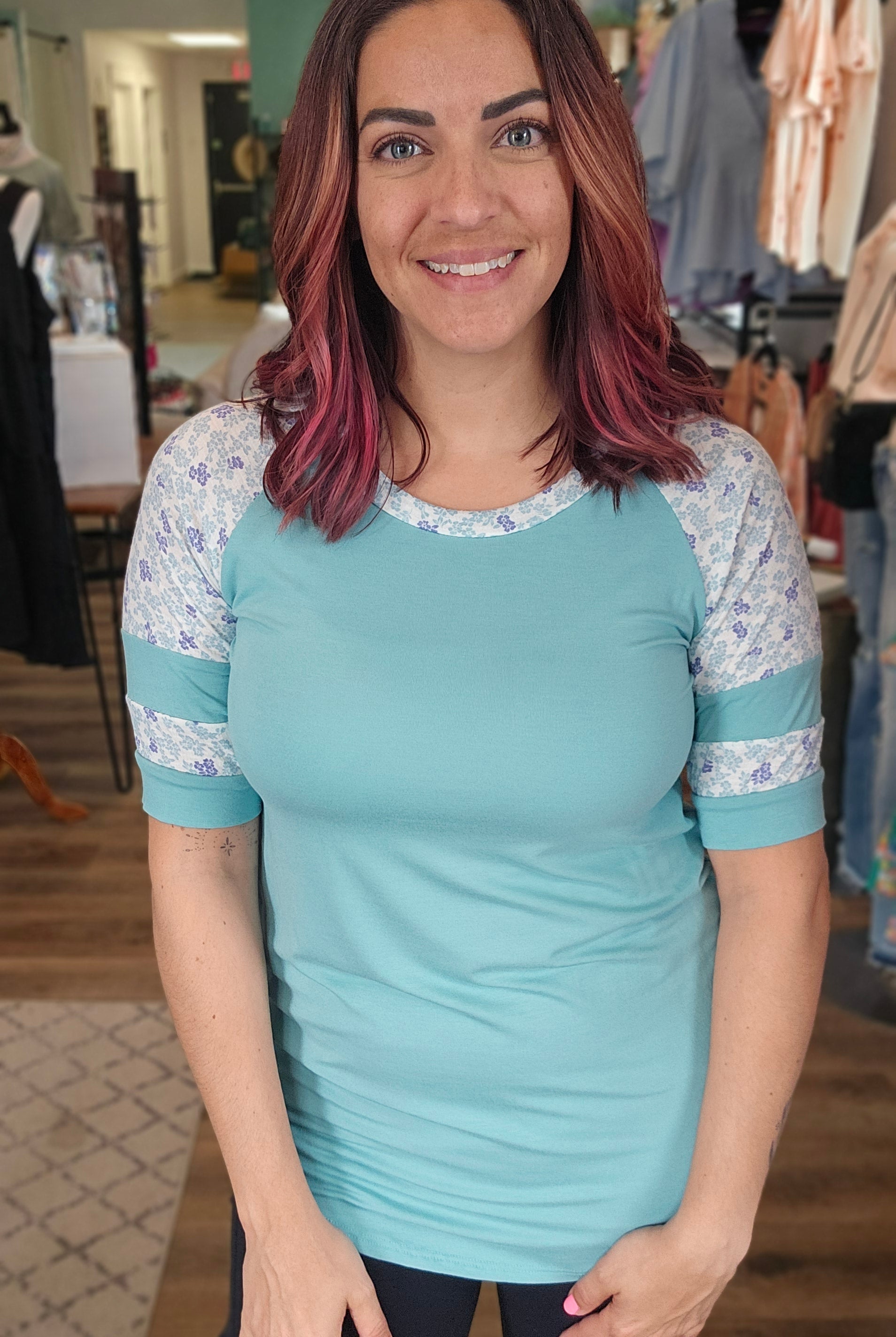 Shop Floral Baseball Sleeve Top-Short Sleeve Top at Ruby Joy Boutique, a Women's Clothing Store in Pickerington, Ohio
