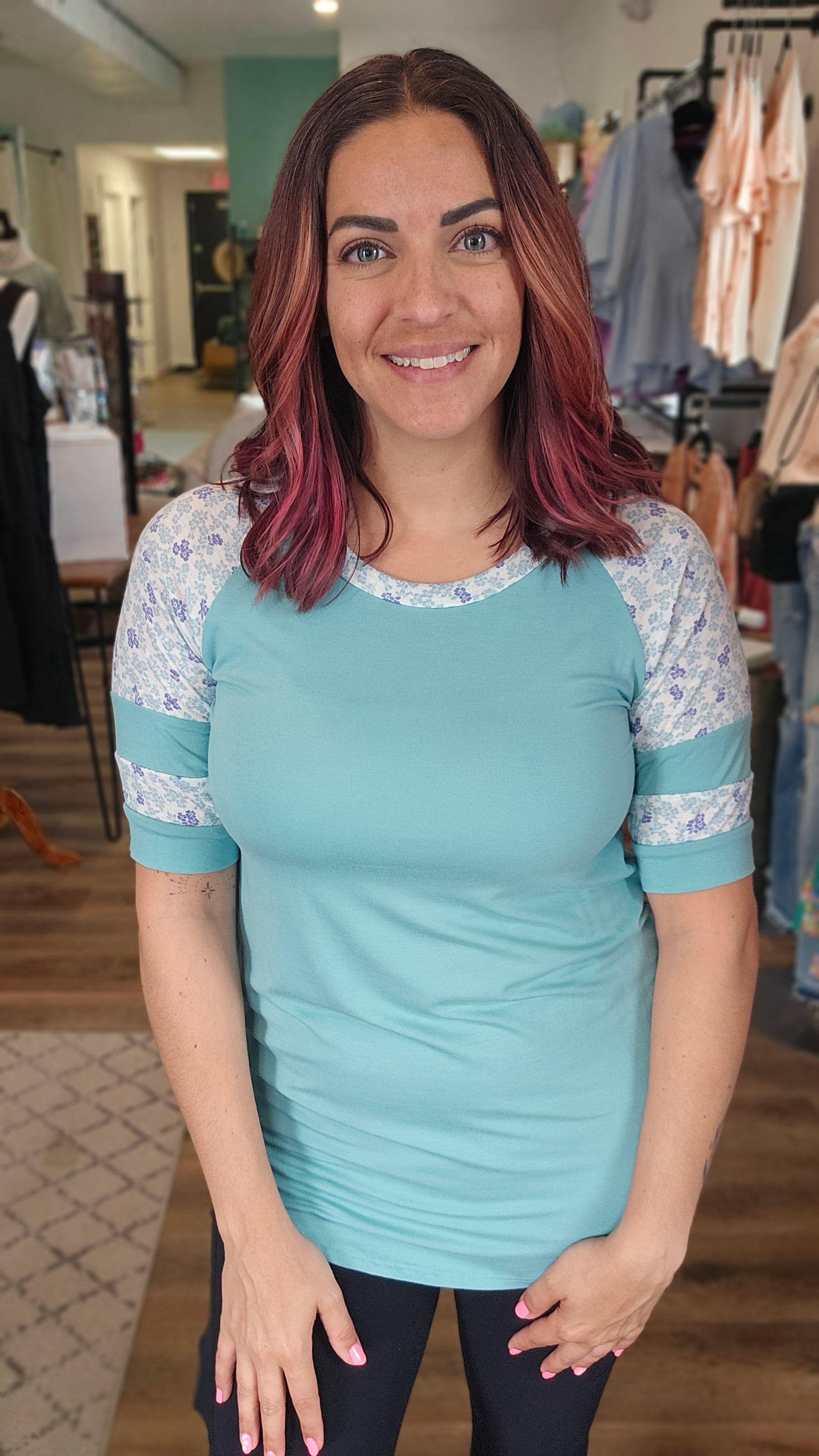 Shop Floral Baseball Sleeve Top-Short Sleeve Top at Ruby Joy Boutique, a Women's Clothing Store in Pickerington, Ohio