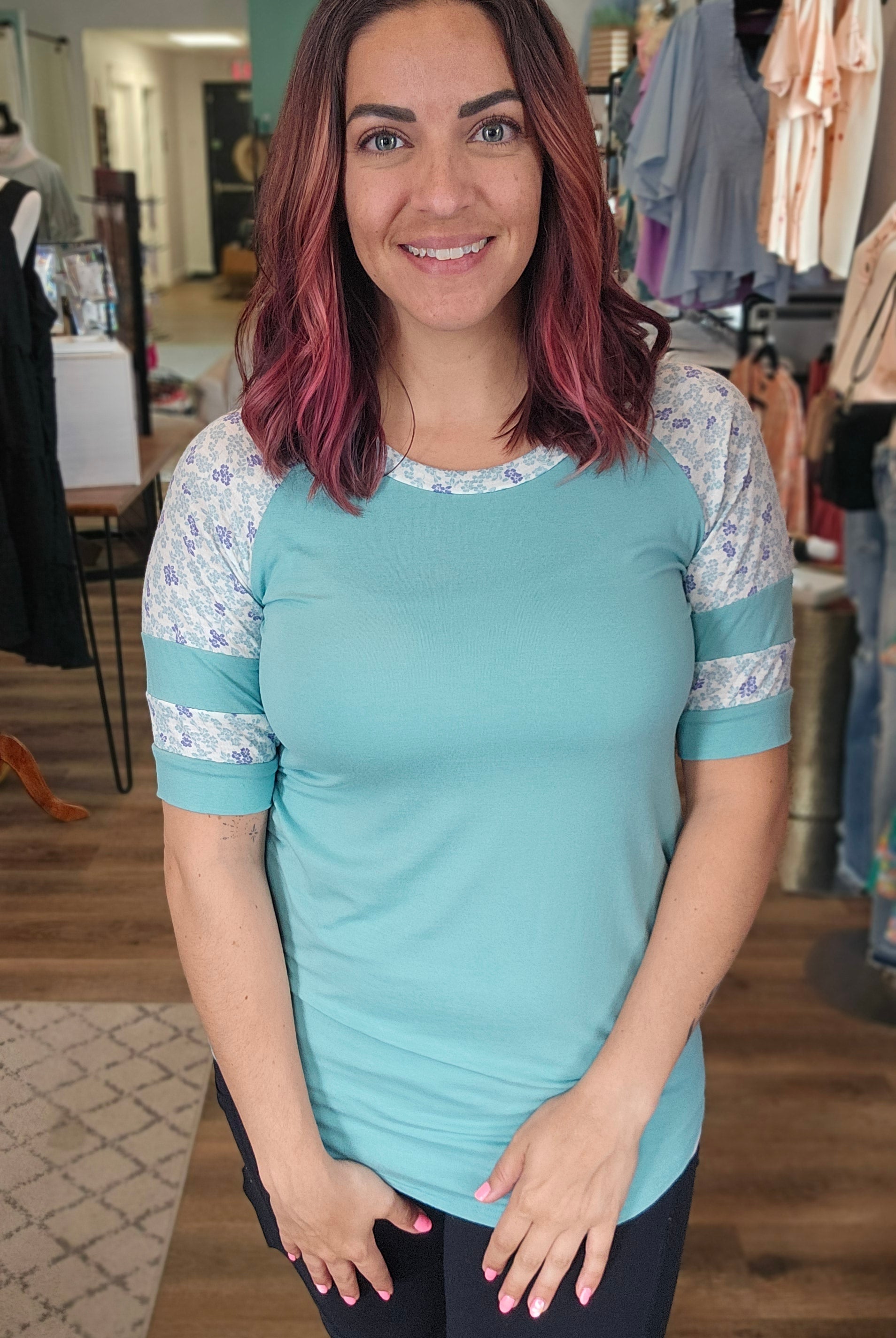 Shop Floral Baseball Sleeve Top-Short Sleeve Top at Ruby Joy Boutique, a Women's Clothing Store in Pickerington, Ohio