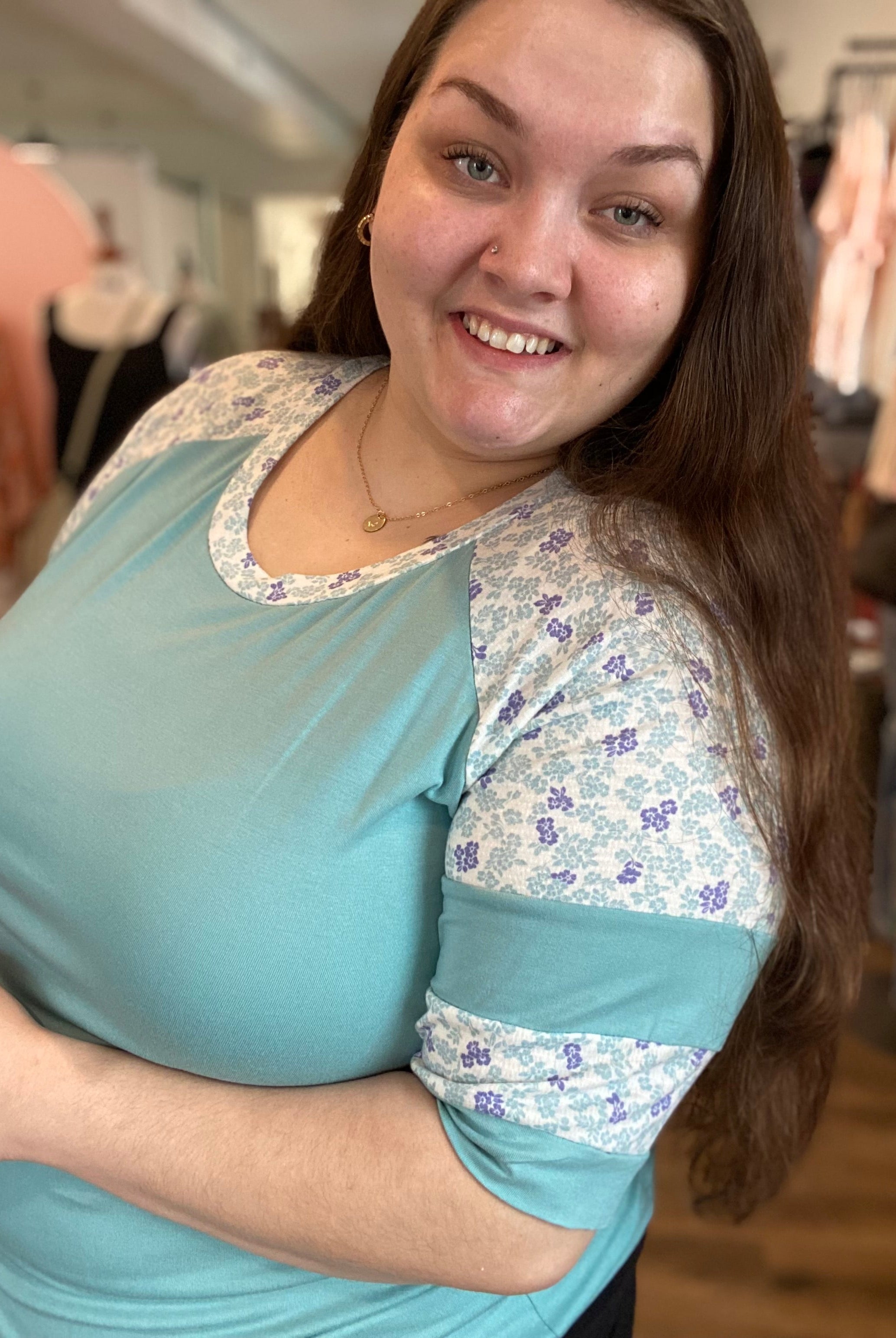 Shop Floral Baseball Sleeve Top-Short Sleeve Top at Ruby Joy Boutique, a Women's Clothing Store in Pickerington, Ohio