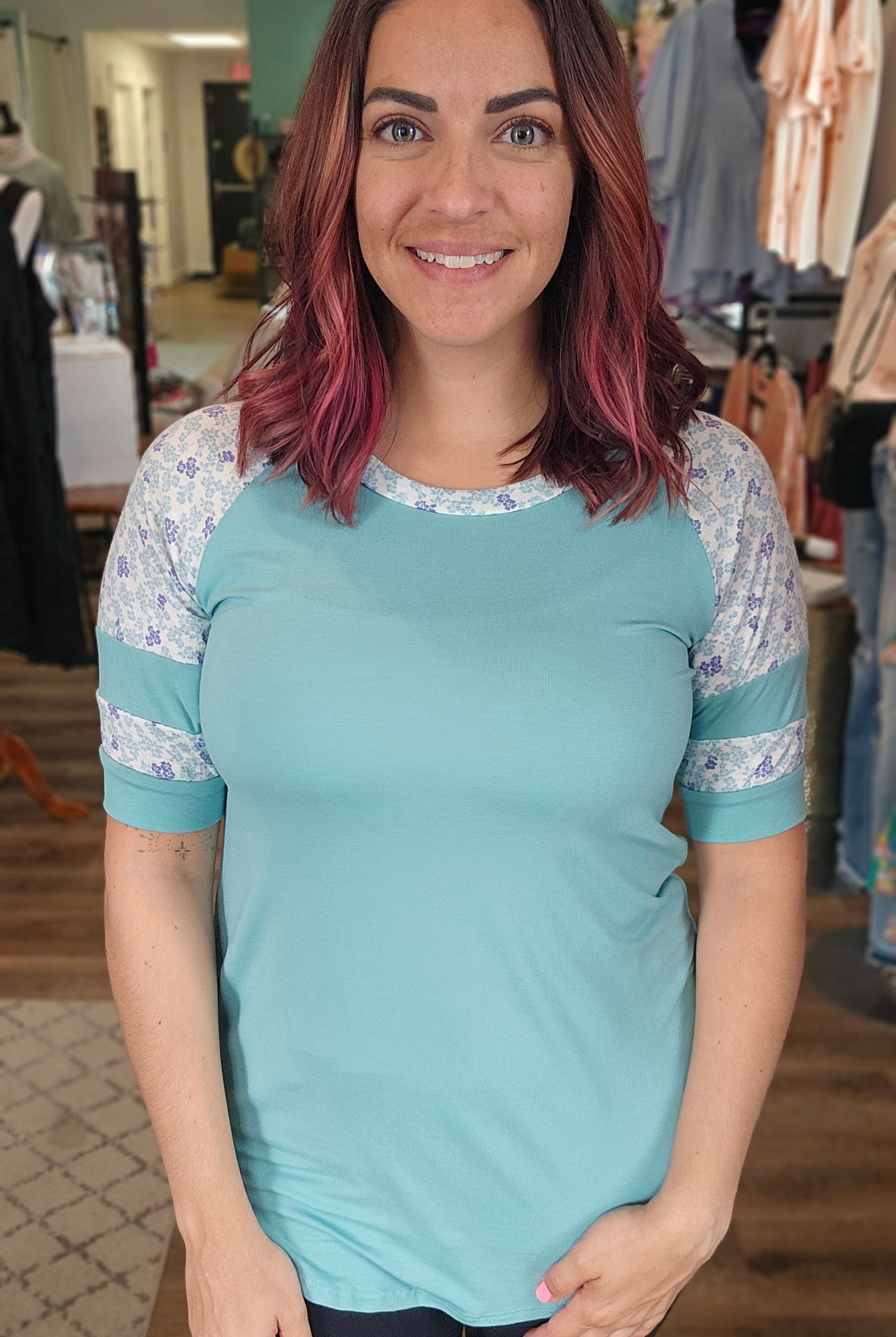 Shop Floral Baseball Sleeve Top-Short Sleeve Top at Ruby Joy Boutique, a Women's Clothing Store in Pickerington, Ohio