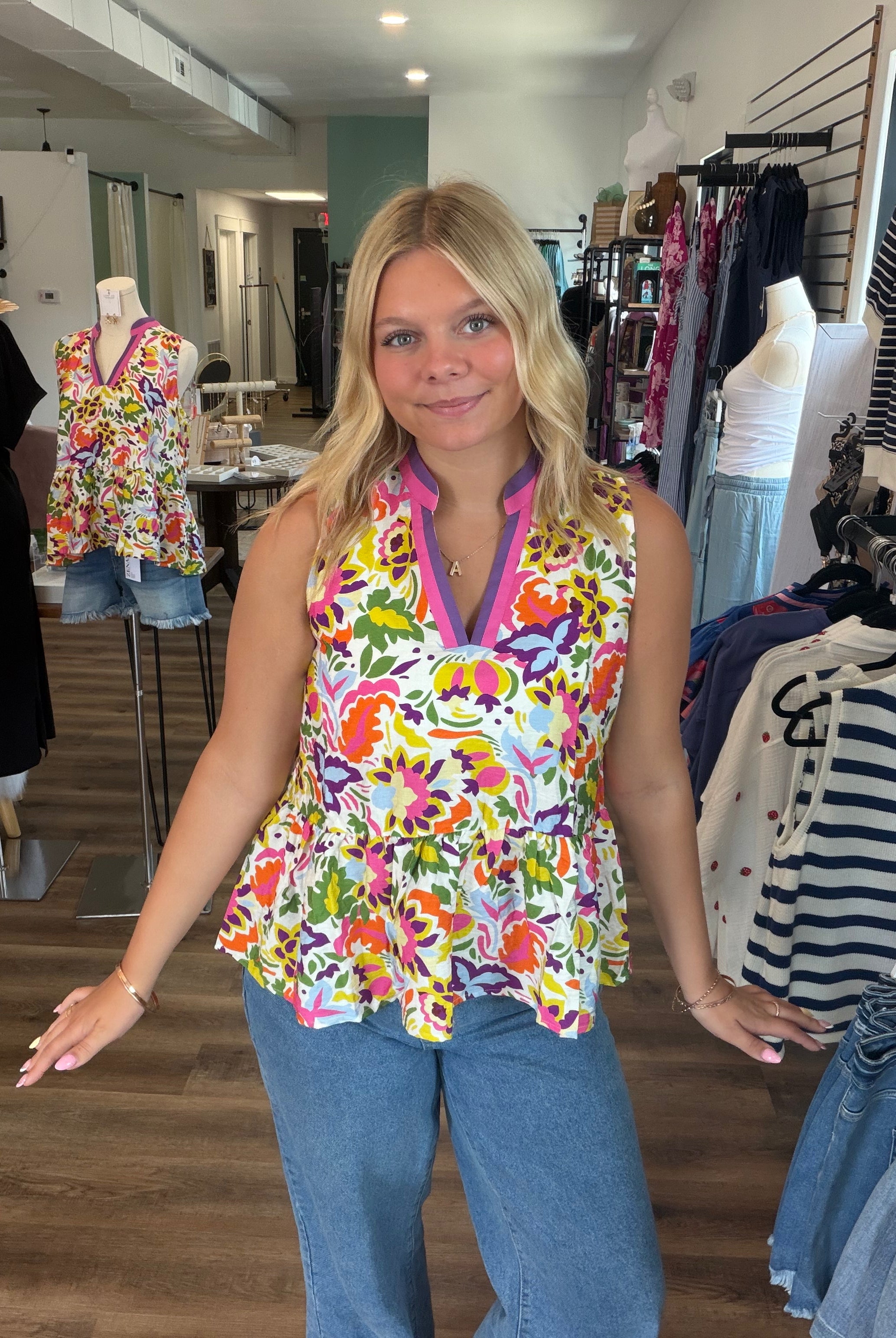 Shop Floral Print Contrast Trim Sleeveless Peplum Blouse- at Ruby Joy Boutique, a Women's Clothing Store in Pickerington, Ohio