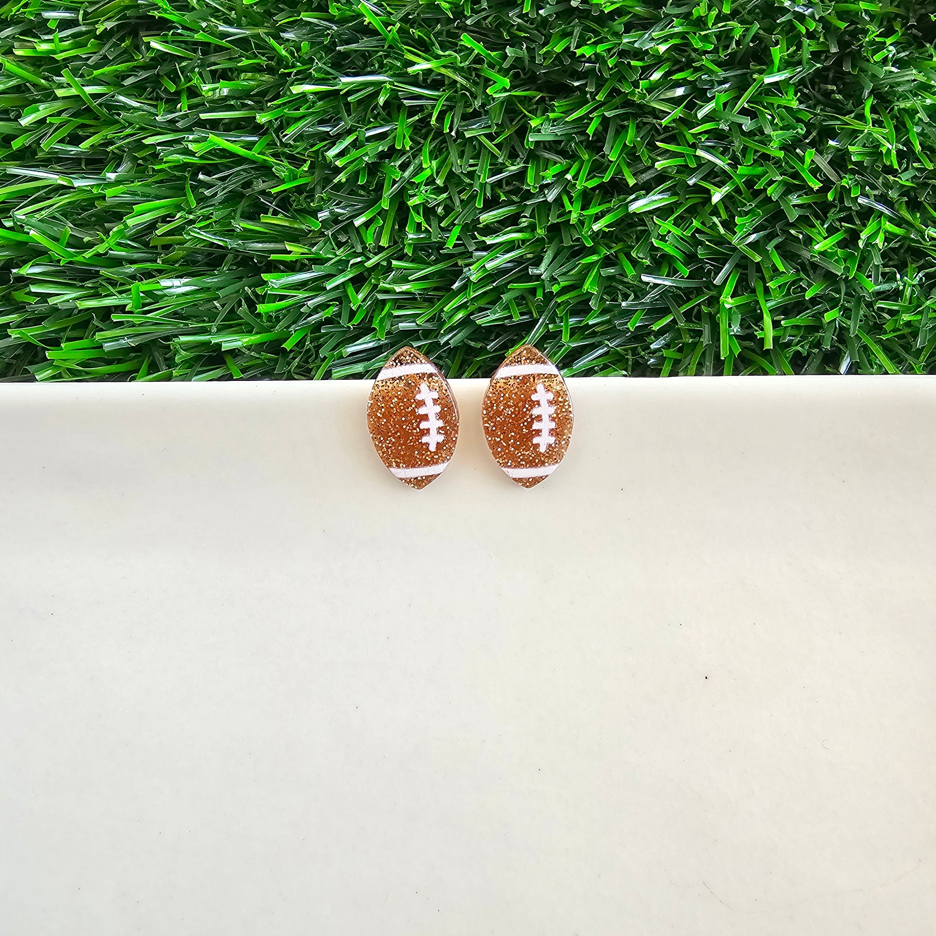 Shop Glitter Football Studs- at Ruby Joy Boutique, a Women's Clothing Store in Pickerington, Ohio