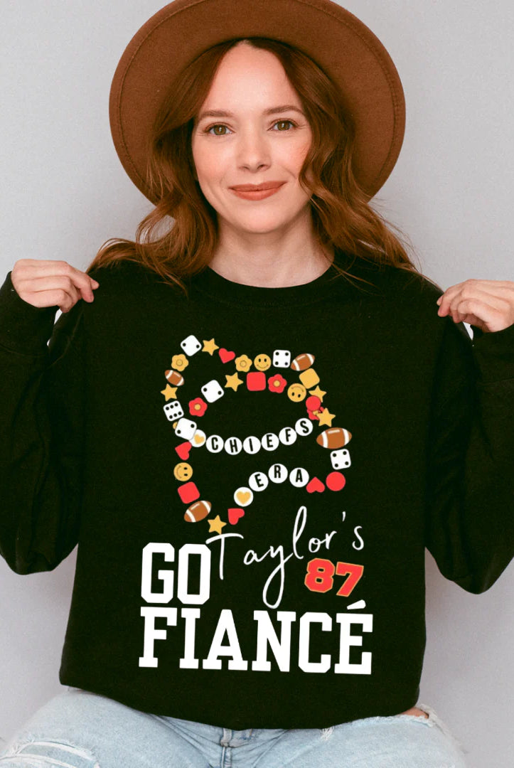 Shop Go Taylor’s Fiancé Bracelet Graphic-Black Comfort Colors Tee at Ruby Joy Boutique, a Women's Clothing Store in Pickerington, Ohio