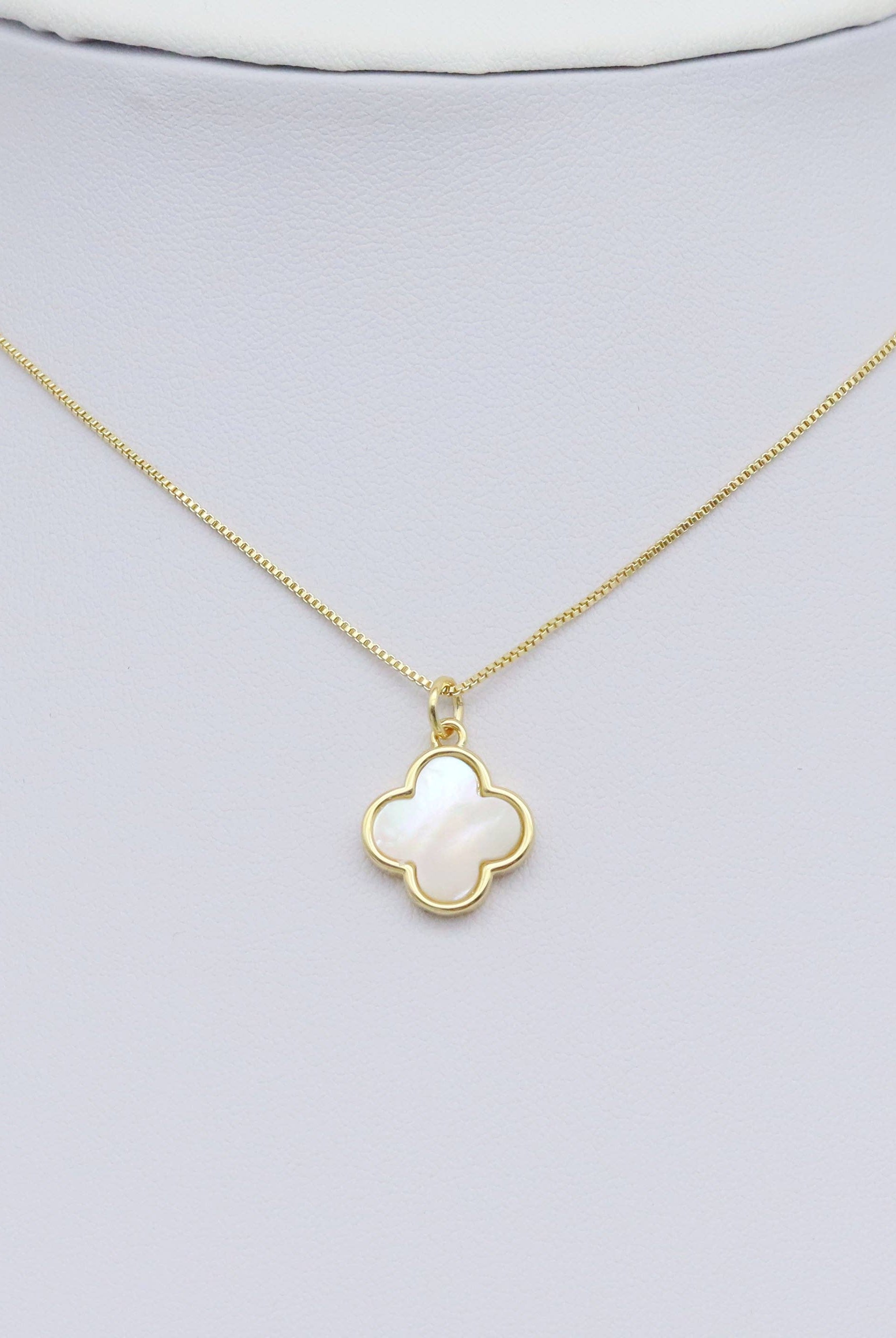 Shop Gold and Mother of Pearl Quatrefoil Charm- at Ruby Joy Boutique, a Women's Clothing Store in Pickerington, Ohio