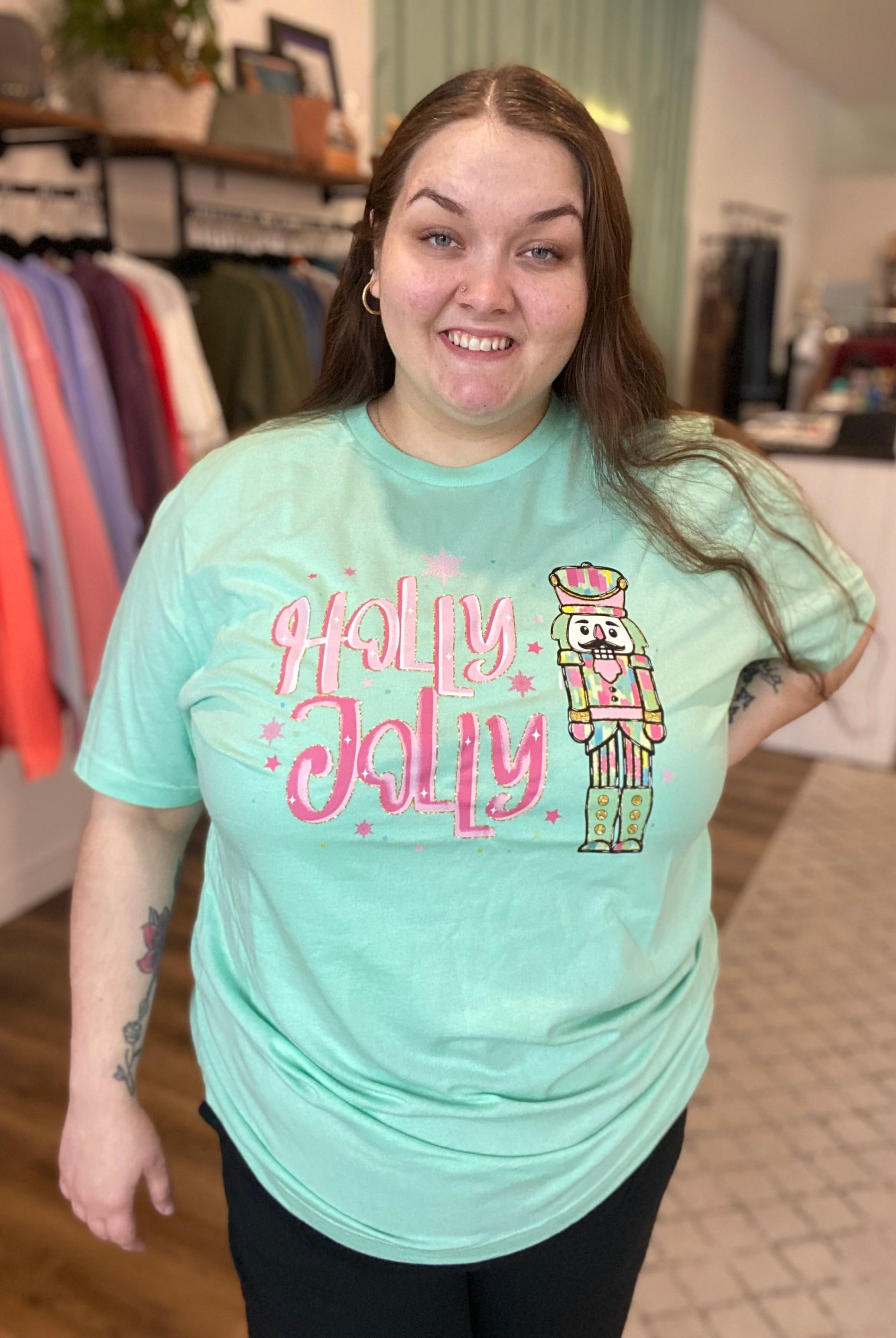 Shop Holly Jolly Bright Nutcracker Tee-Graphic Tee at Ruby Joy Boutique, a Women's Clothing Store in Pickerington, Ohio