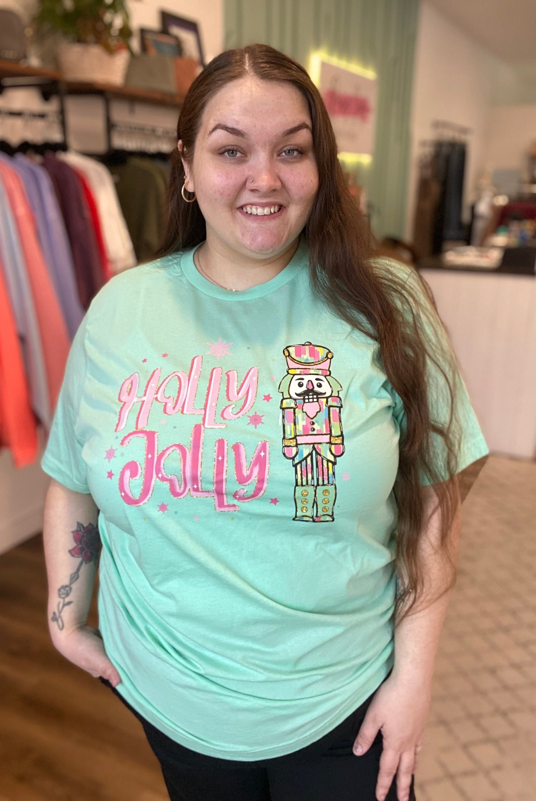 Shop Holly Jolly Bright Nutcracker Tee-Graphic Tee at Ruby Joy Boutique, a Women's Clothing Store in Pickerington, Ohio