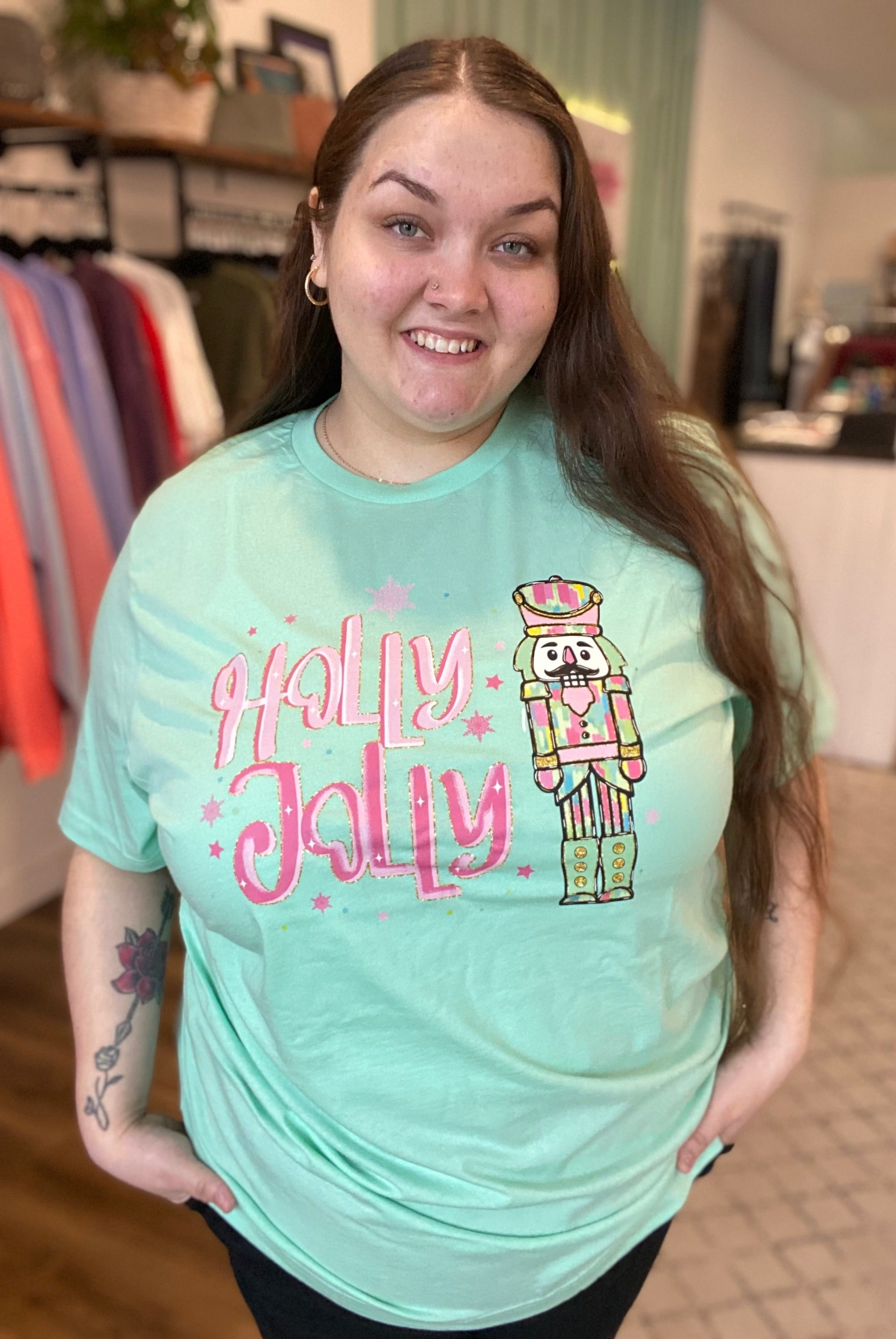 Shop Holly Jolly Bright Nutcracker Tee-Graphic Tee at Ruby Joy Boutique, a Women's Clothing Store in Pickerington, Ohio