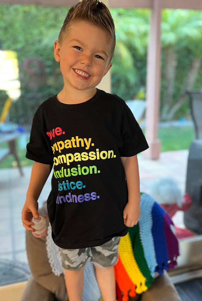 Shop 'Kindness Is' Pride Kids Tee | Kind Cotton- at Ruby Joy Boutique, a Women's Clothing Store in Pickerington, Ohio